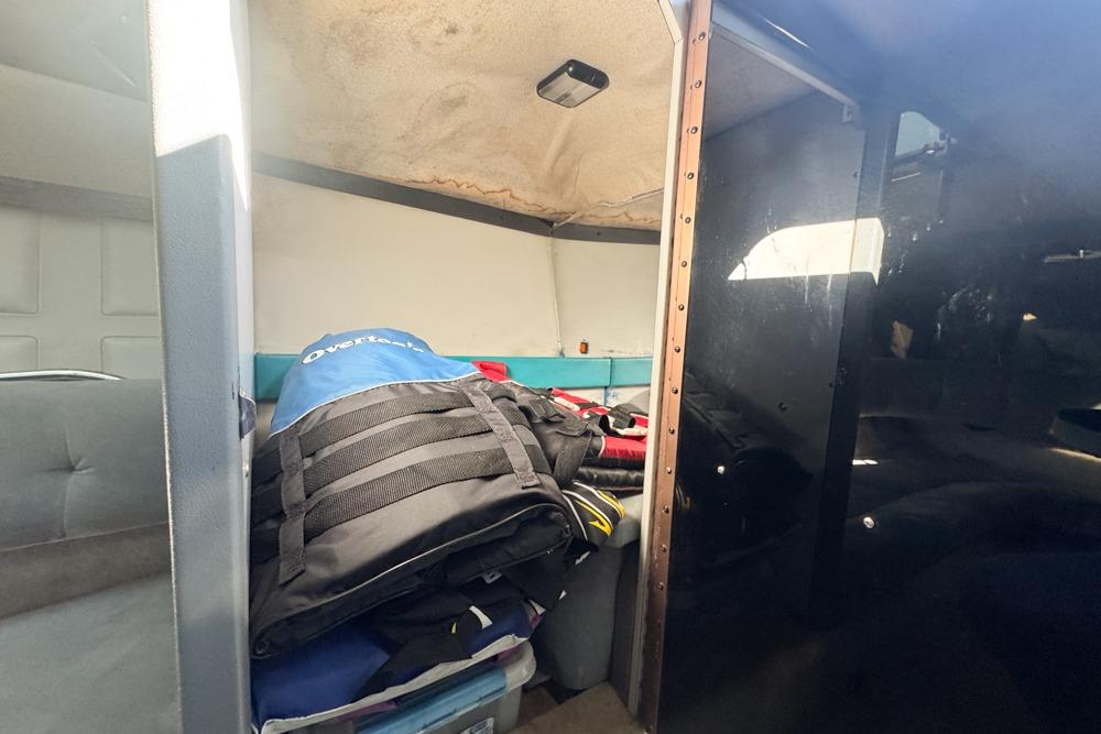 Interior of a 1989 Formula 292 SR-1 boat with storage and seating area.