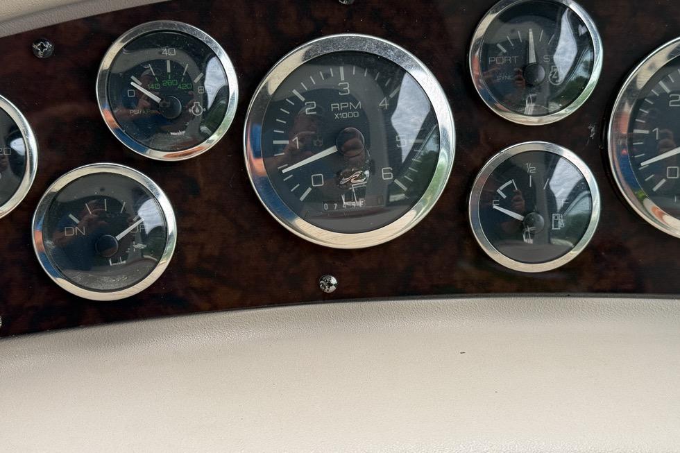 Dashboard gauges of a 1999 Sea Ray 290 Sundancer boat.