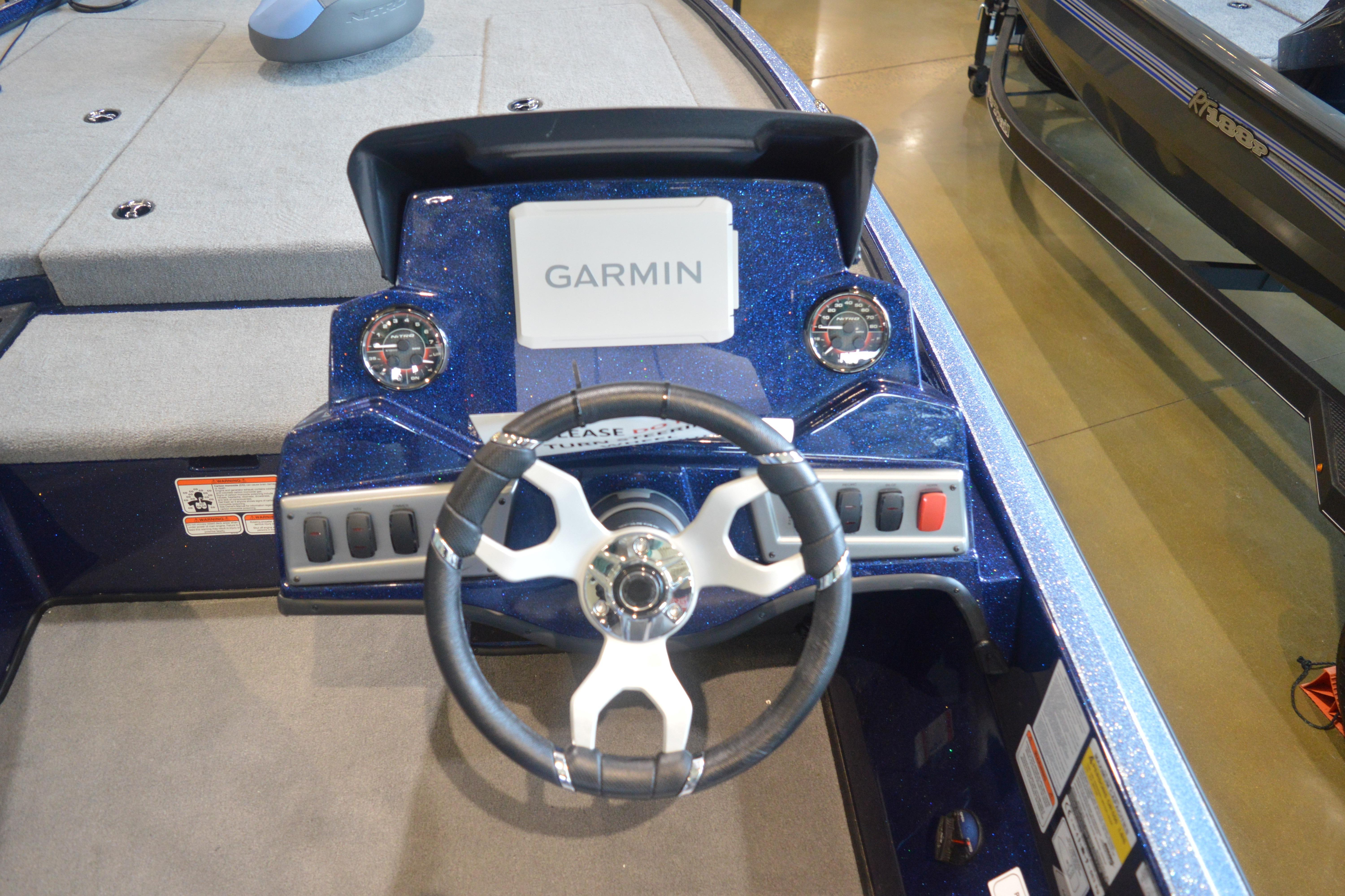 Steering console of 2026 Nitro Z18 Pro boat with Garmin display and gauges.