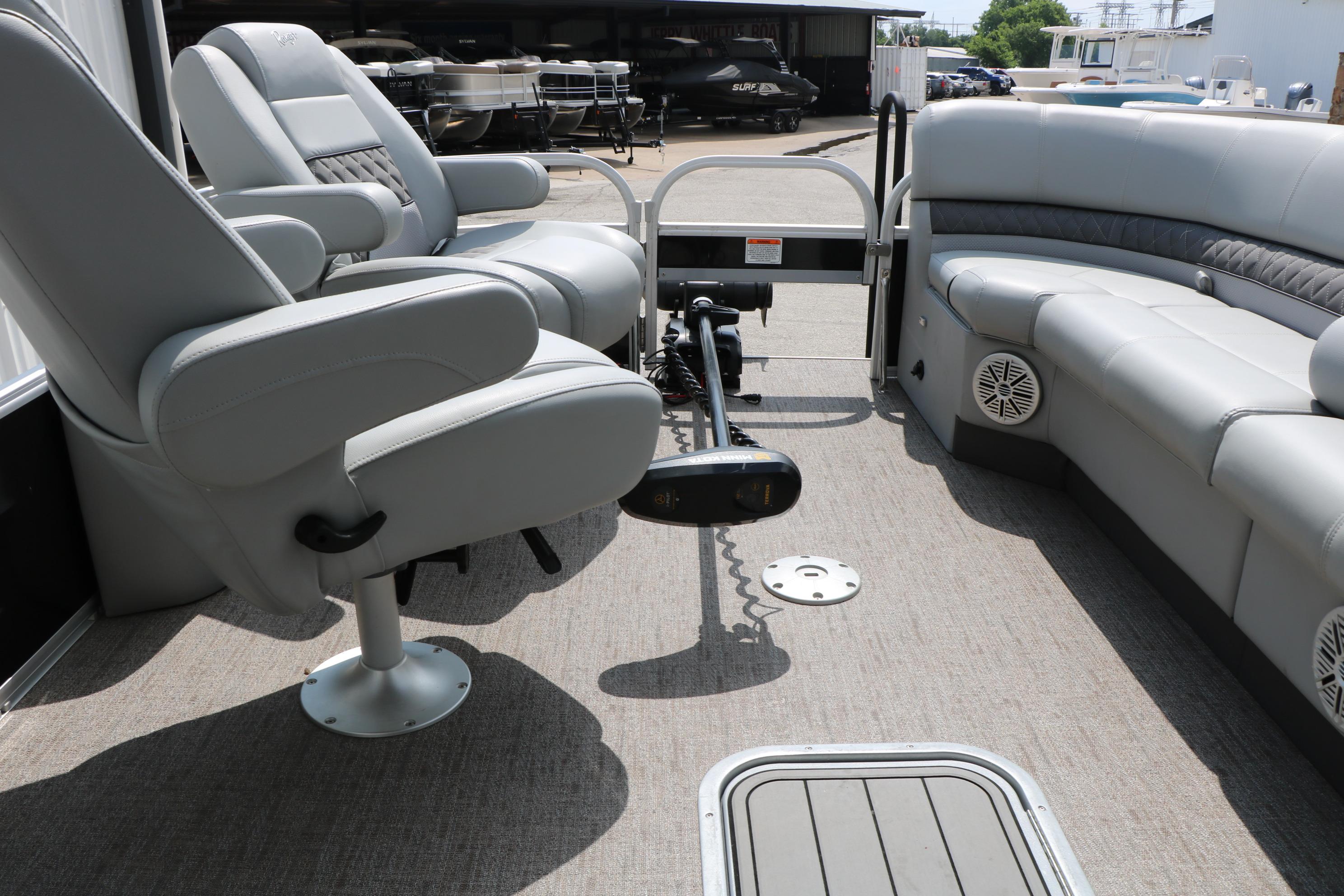 Interior of 2021 Ranger 223FC boat with gray seating and carpeted floor.