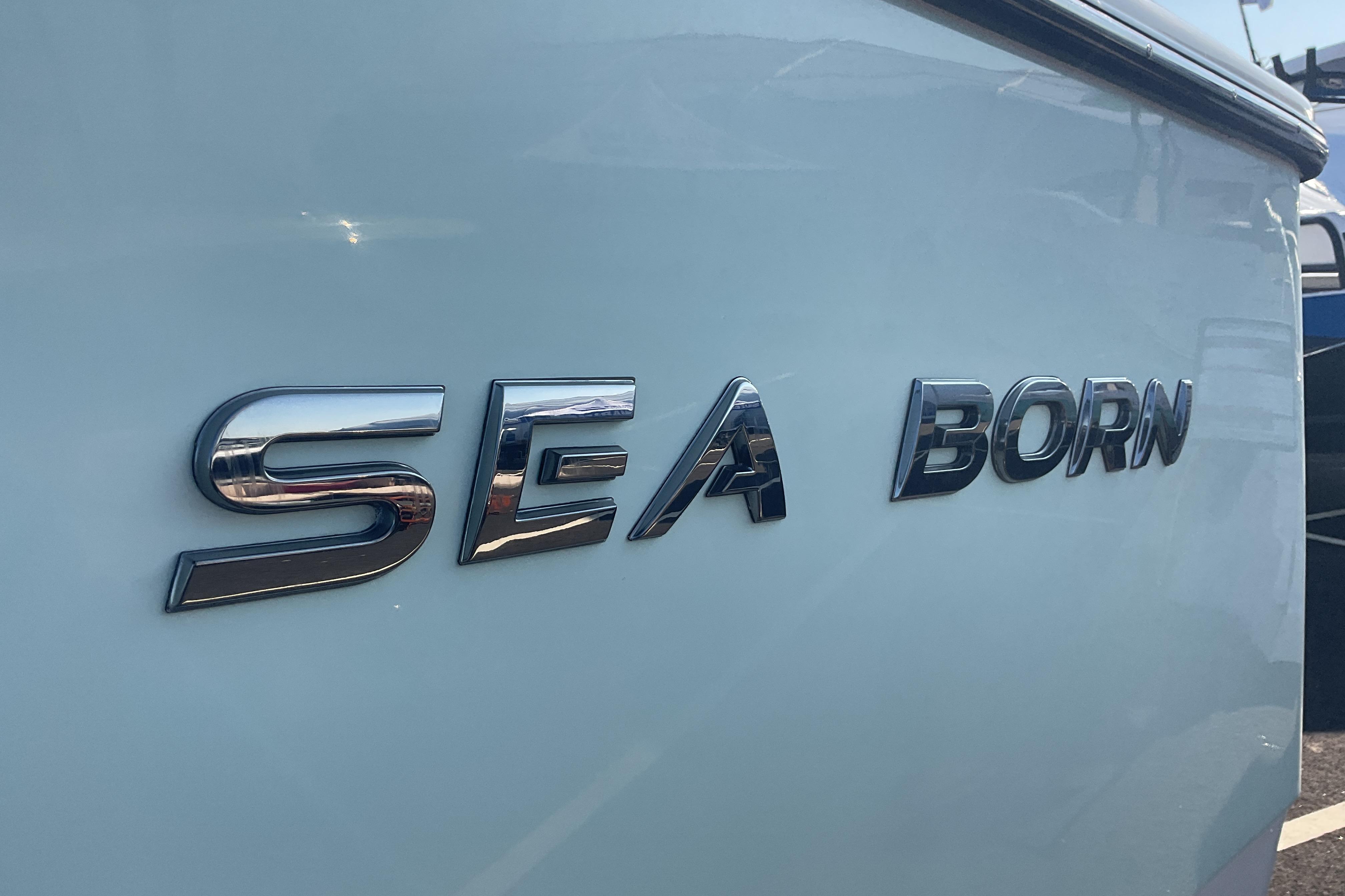 2023 Sea Born SX239 Offshore boat logo on hull.