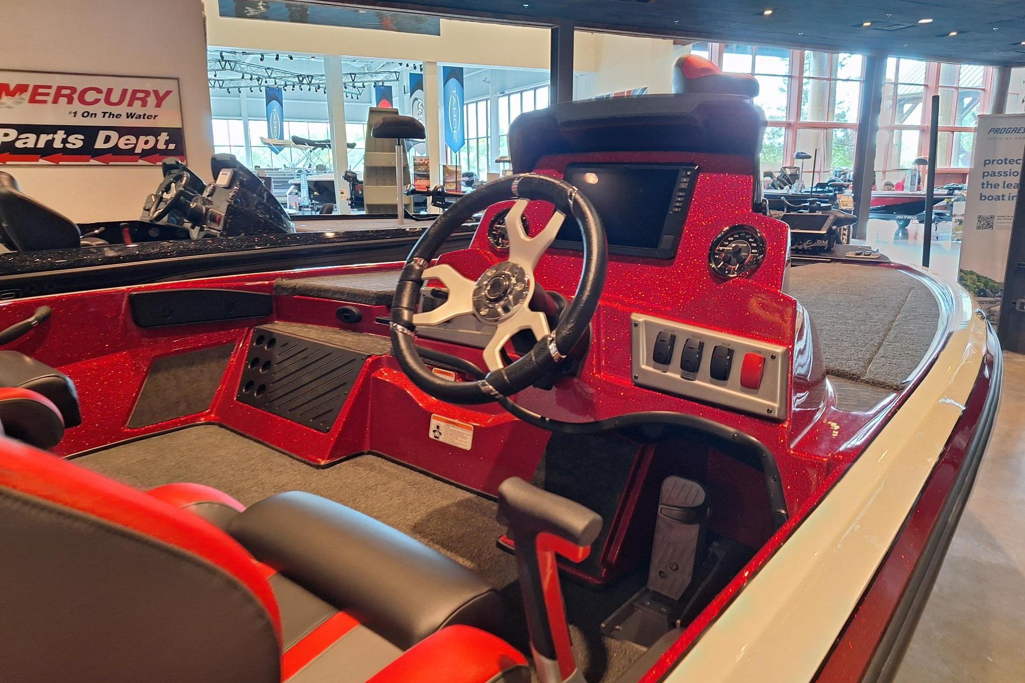 2026 Nitro Z19 XL Pro boat interior with steering wheel and control panel.