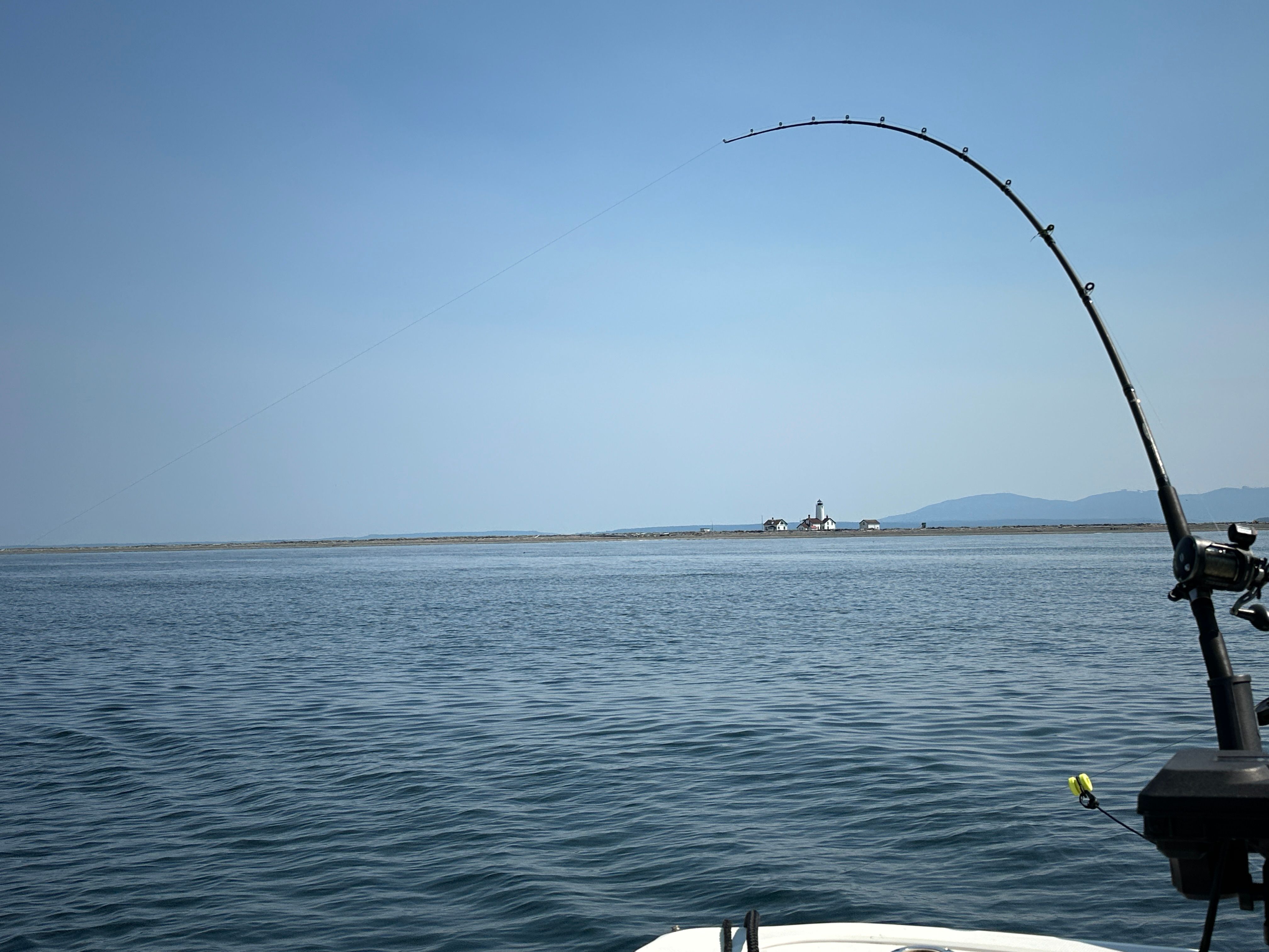 Fishing rod on a 2005 Sea Ray 290 Amberjack boat on the water.