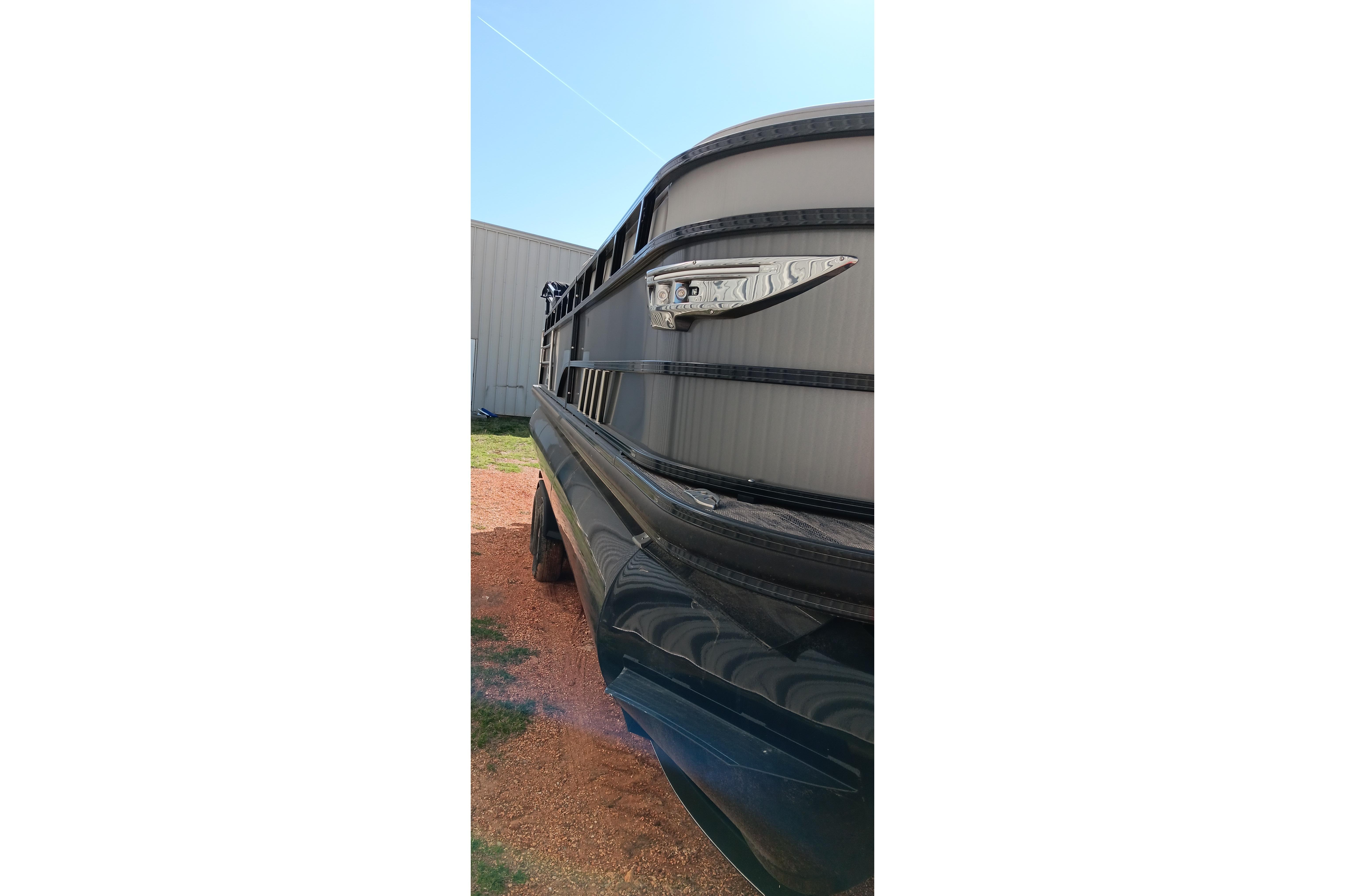 2023 Ranger 2500LS boat side view with sleek design and metallic accents.