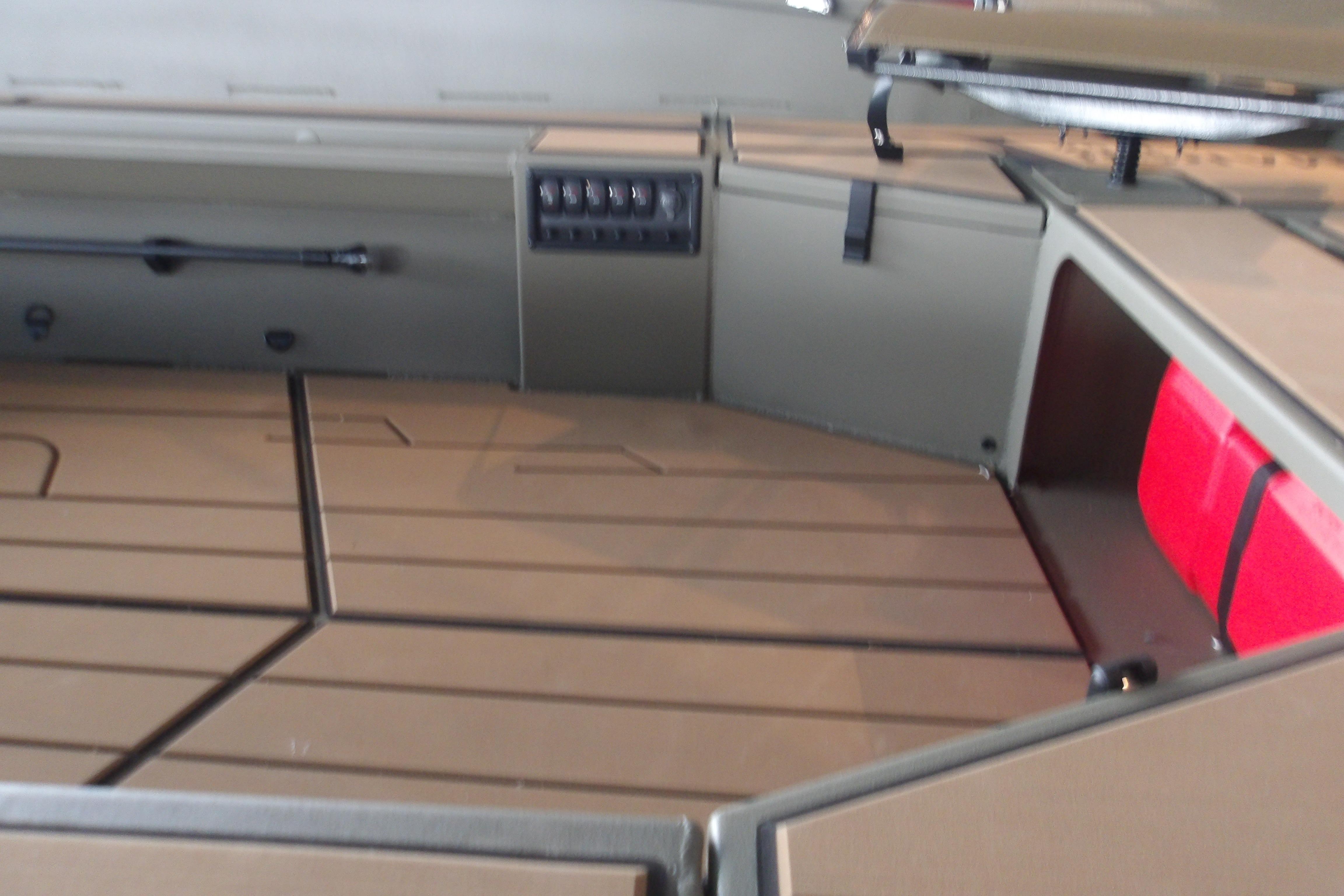 Interior of 2026 Tracker Grizzly 1756 T Marsh boat, featuring storage compartments.