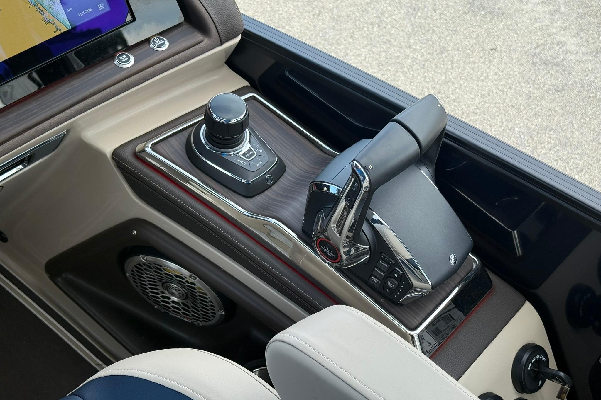 Control panel of 2026 Bennington 27 QSBAT2 boat with joystick and throttle.