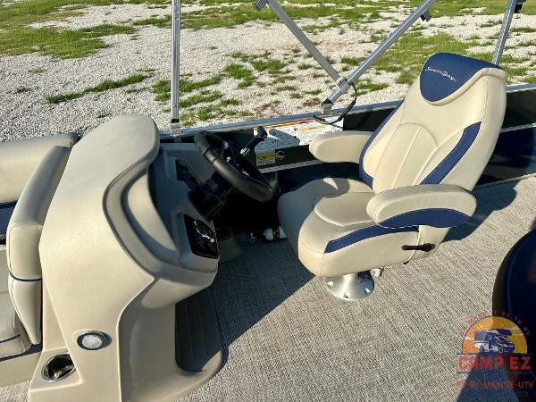 2025 South Bay 224FCR LE boat interior with captain's chair and steering console.