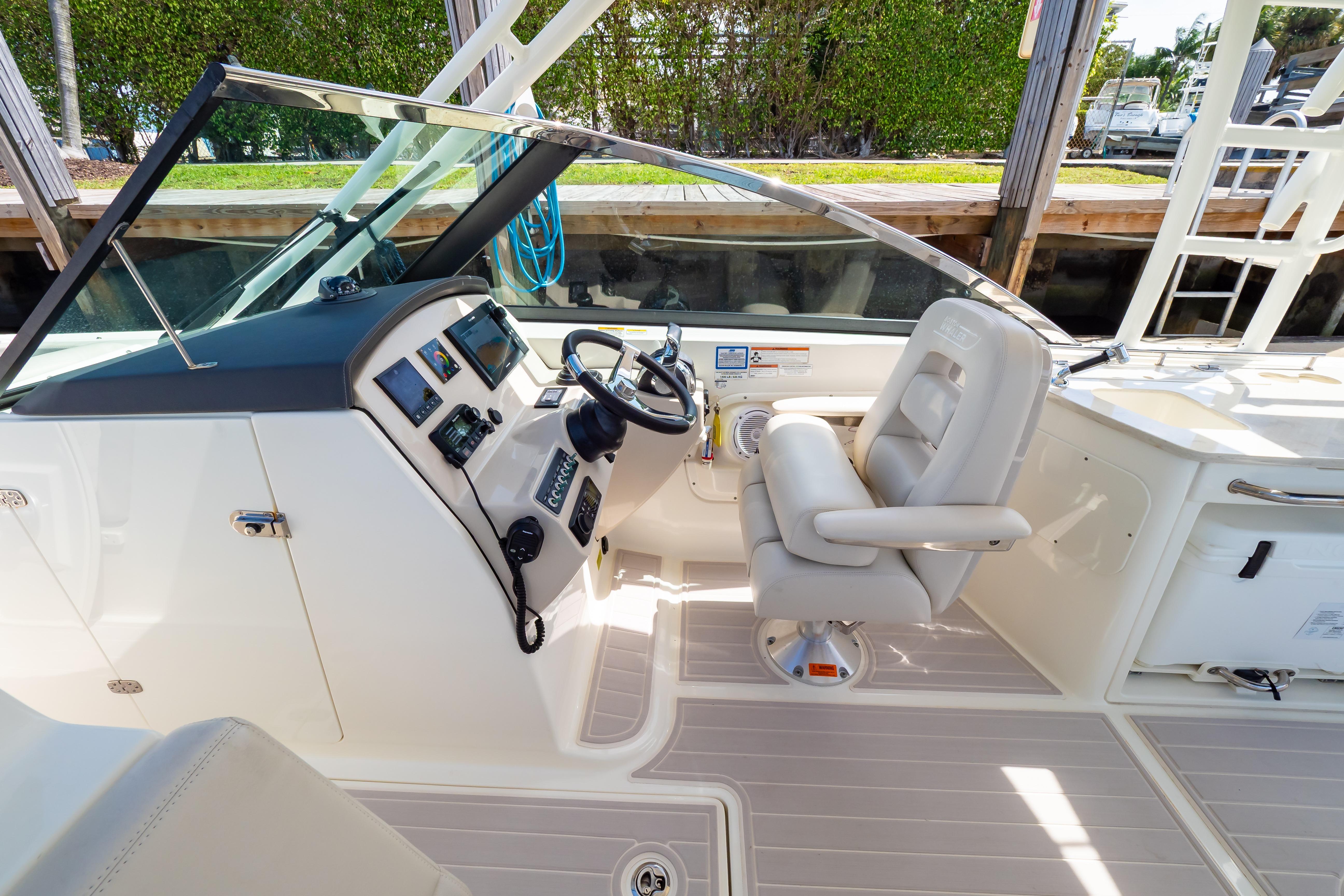 2019 Boston Whaler 270 Vantage helm with steering wheel and control panel.