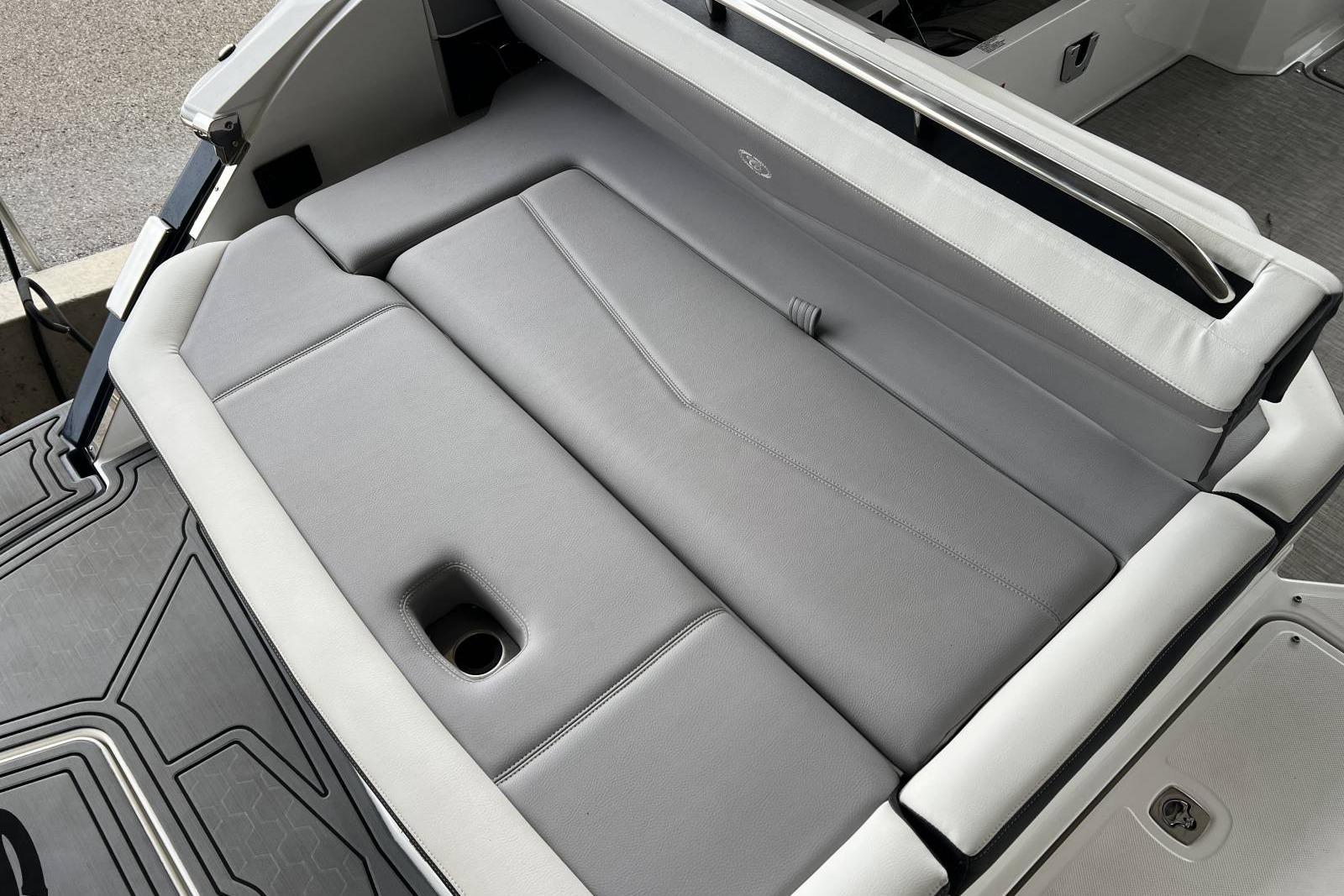 2022 Cobalt R8 Surf boat with sleek gray seating and integrated cup holder.