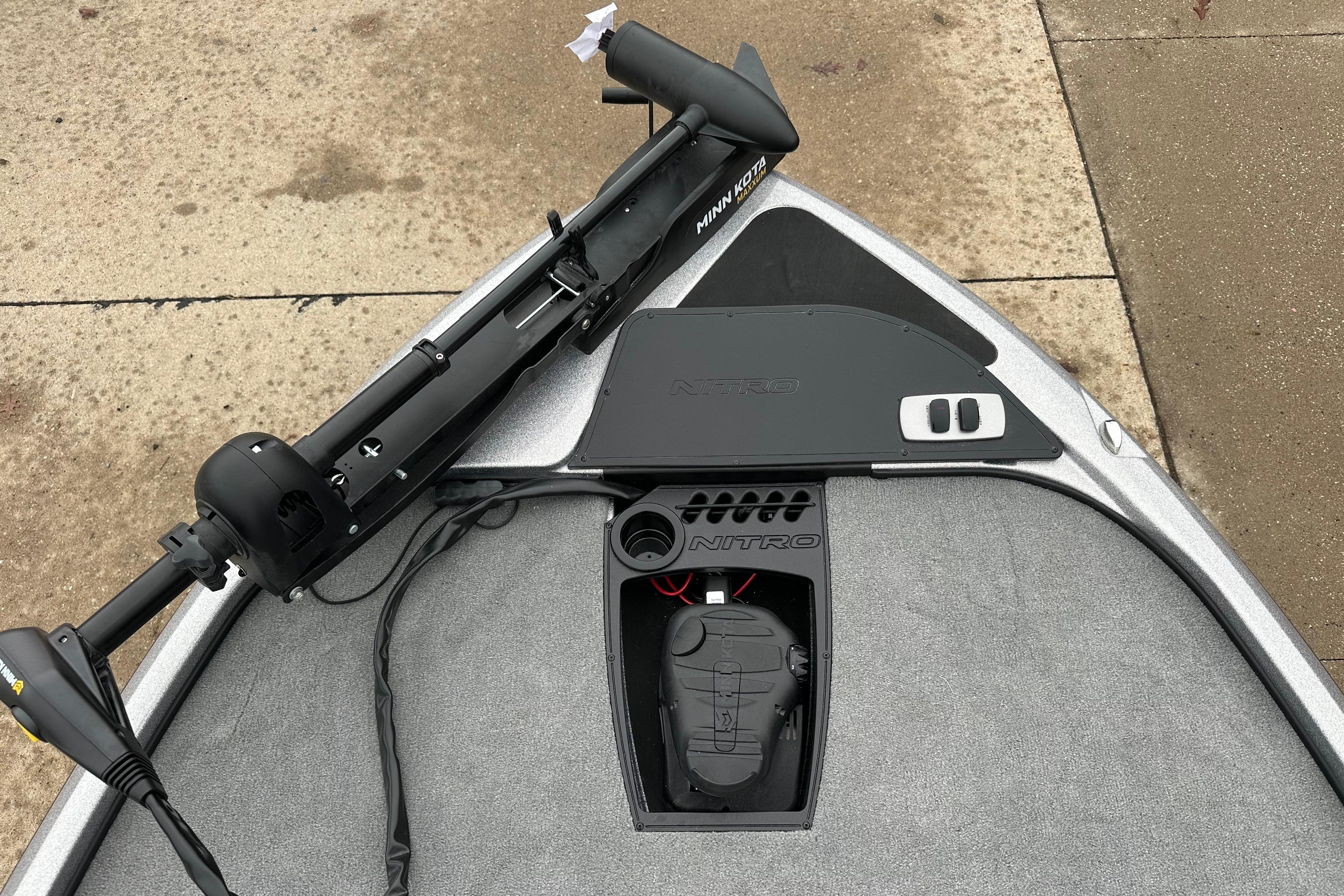 2026 Nitro Z18 boat deck with Minn Kota trolling motor, featuring storage compartments.