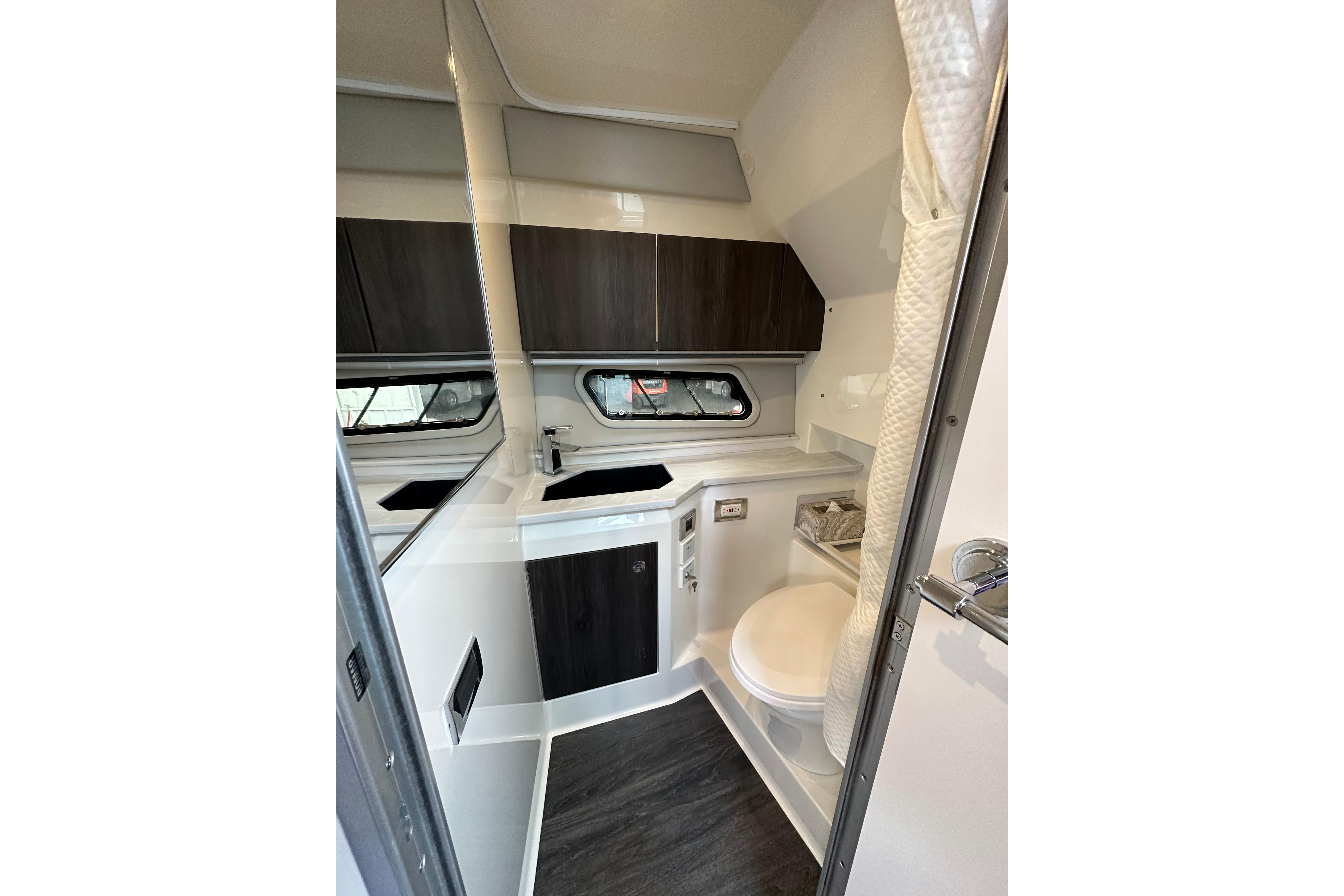 2021 Formula 380 Super Sport Crossover OB cabin bathroom with modern fixtures and sleek design.