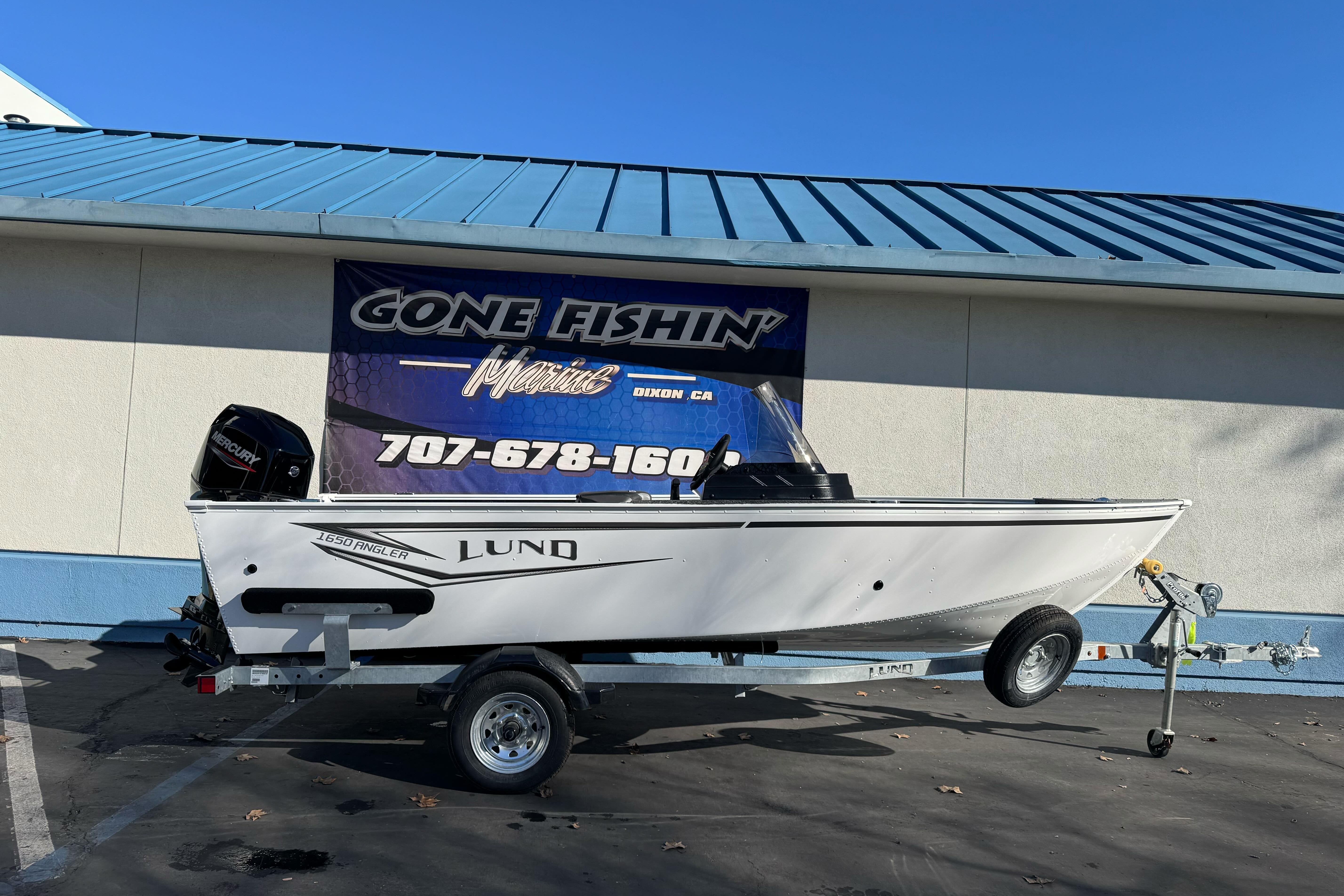 2026 Lund 1650 Angler SS boat on trailer outside Gone Fishin' Marine.