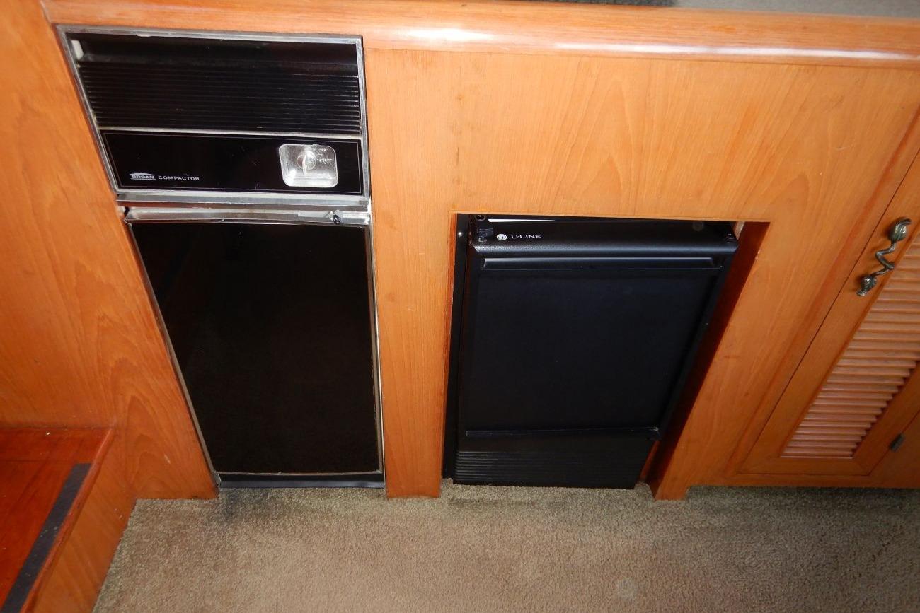 1988 Angel Pilothouse interior with built-in trash compactor and refrigerator.