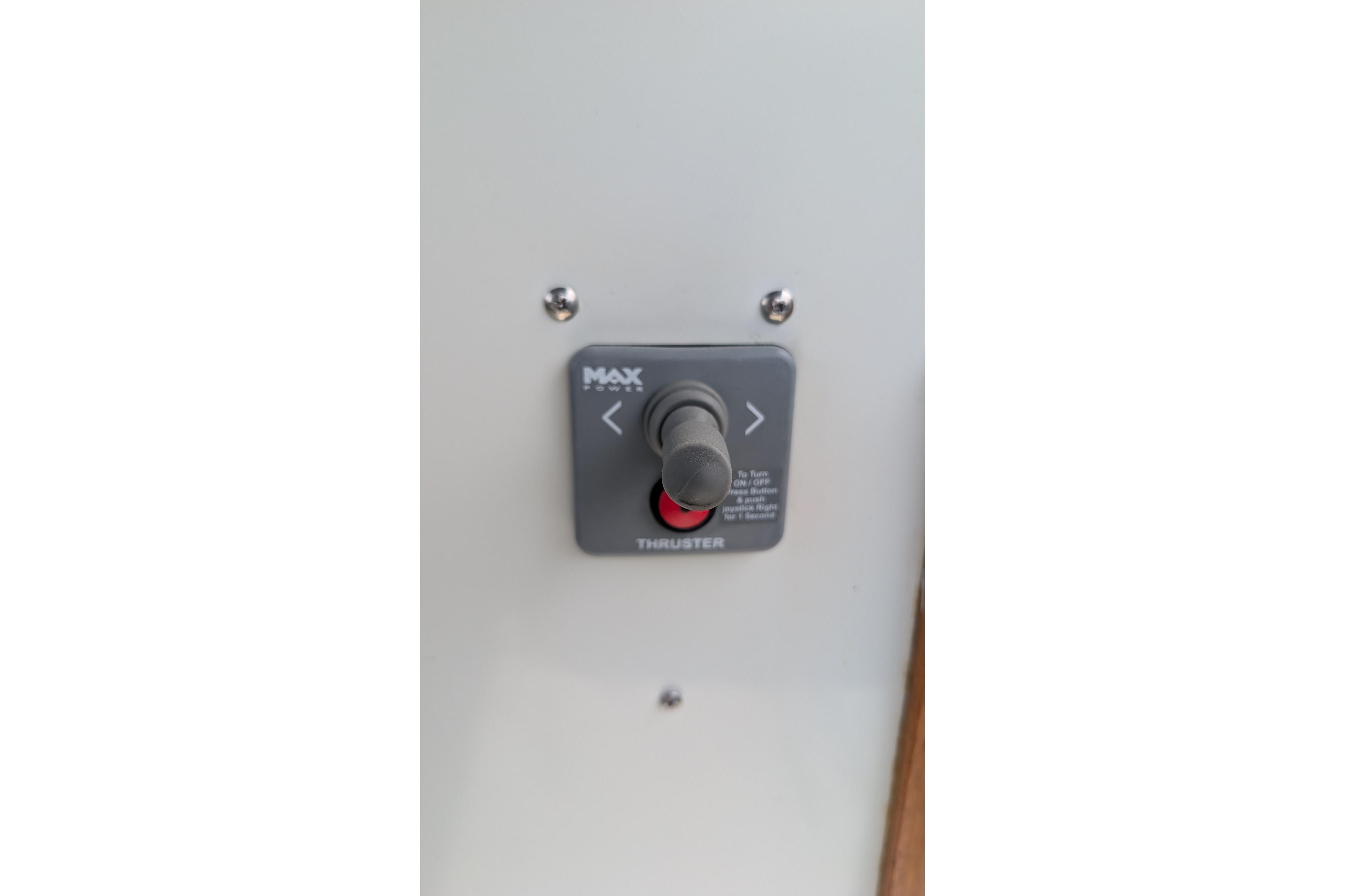 Control panel of a 1987 Prowler 9M boat featuring a thruster switch.