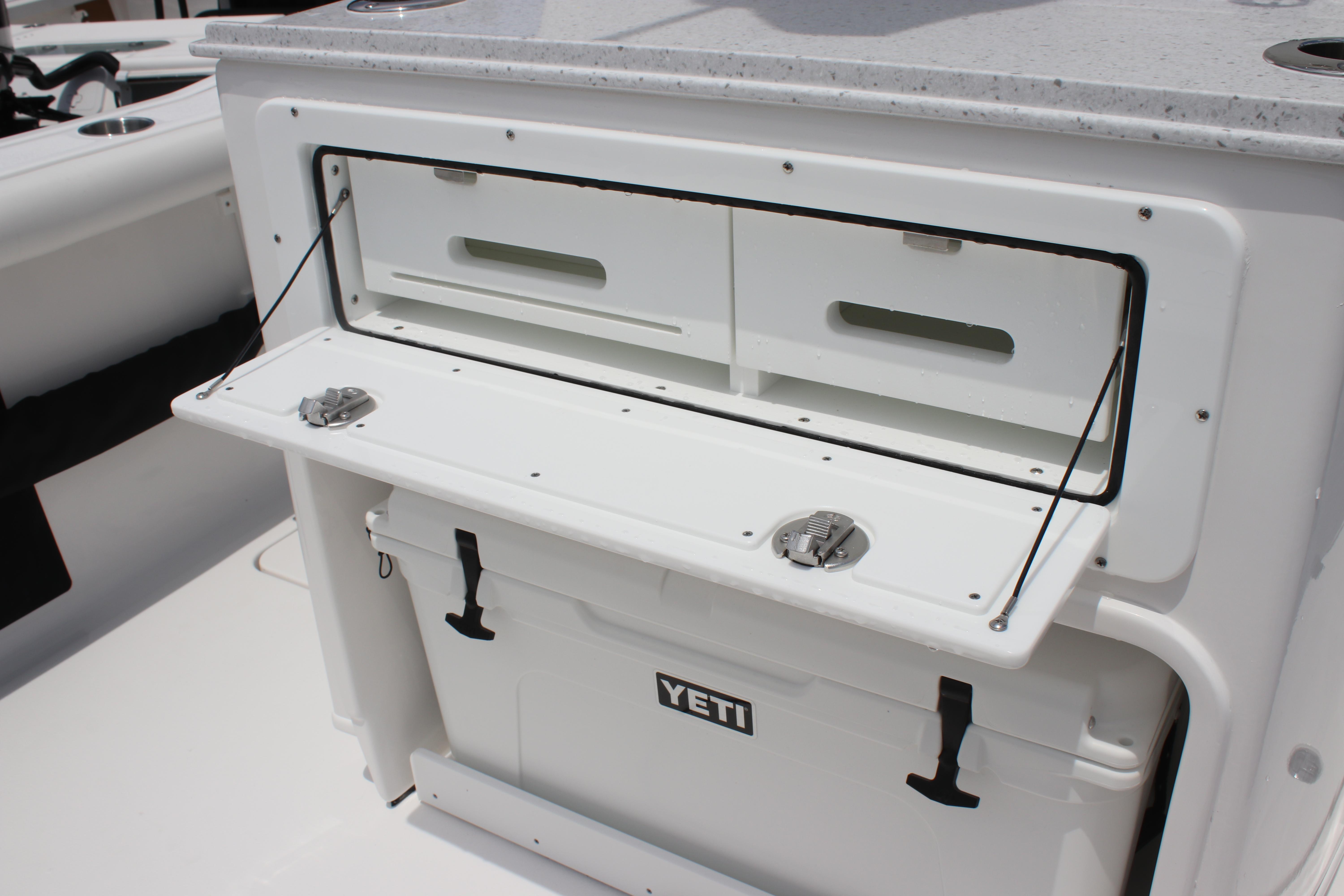 2026 Tidewater 272 LXF boat with Yeti cooler and storage compartment.