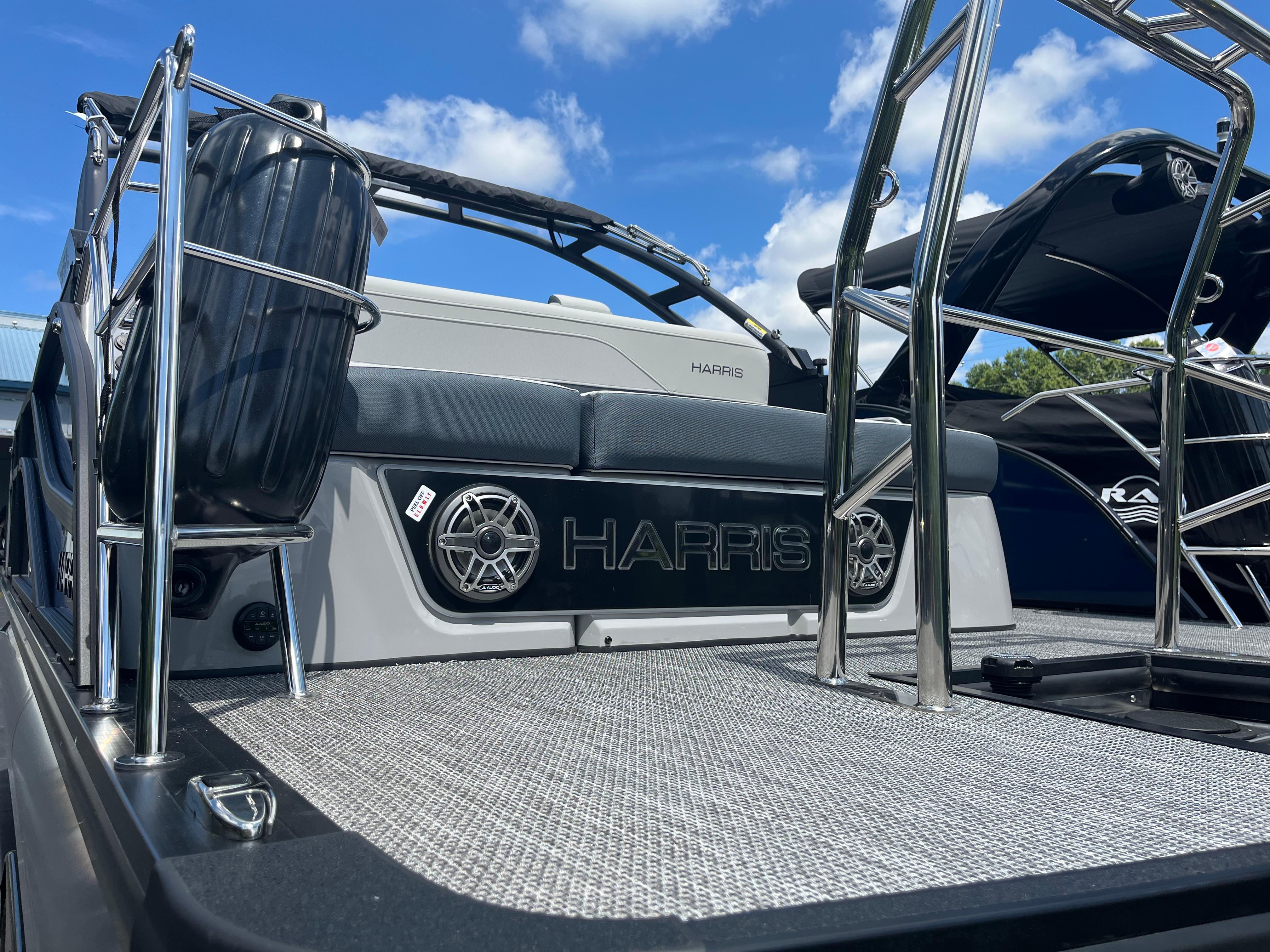 2026 Harris Grand Mariner 230 boat deck with stainless steel railings and speakers.