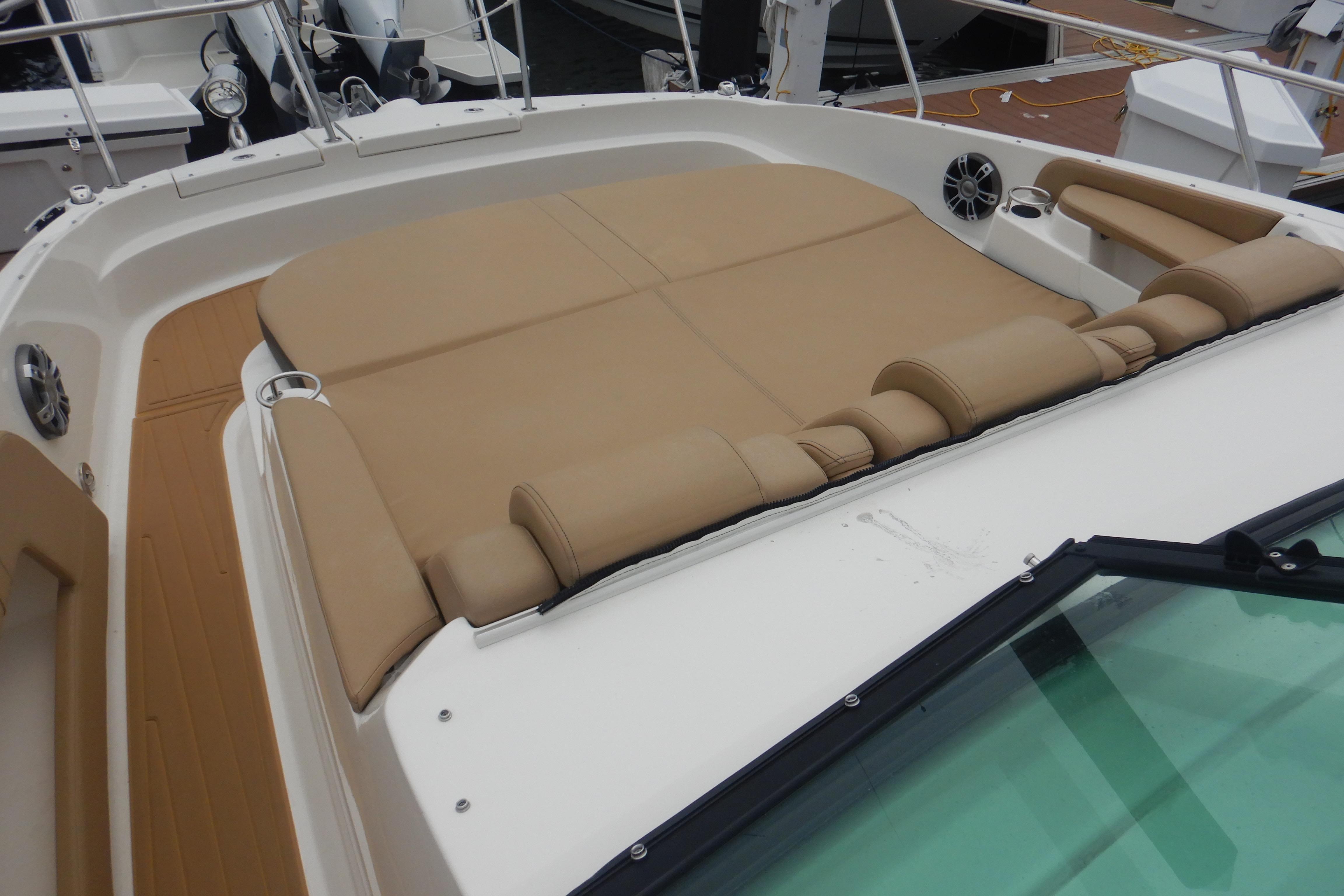 2023 Sea Ray Sundancer 320 boat with spacious tan sunbed and sleek design.