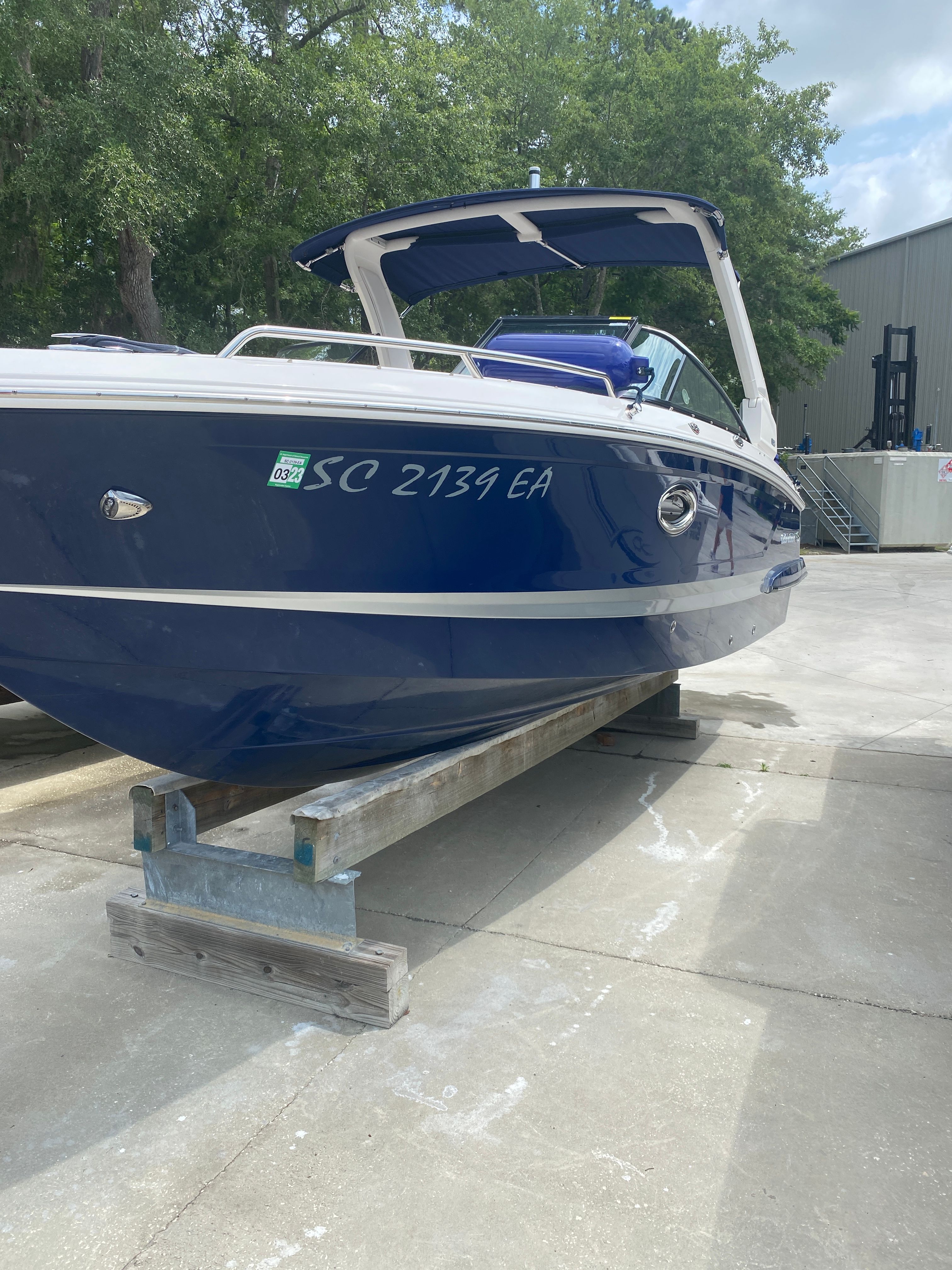 2020 Chaparral 256 SSX boat on a dock.