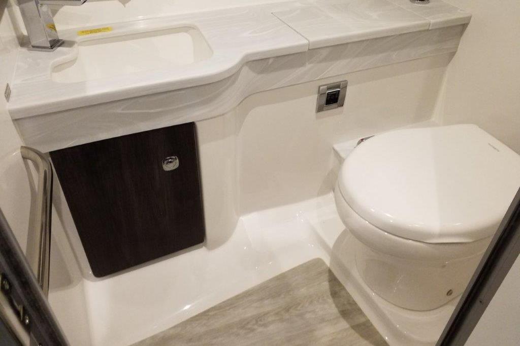 2021 Formula 350 Sun Sport bathroom with modern sink and toilet design.