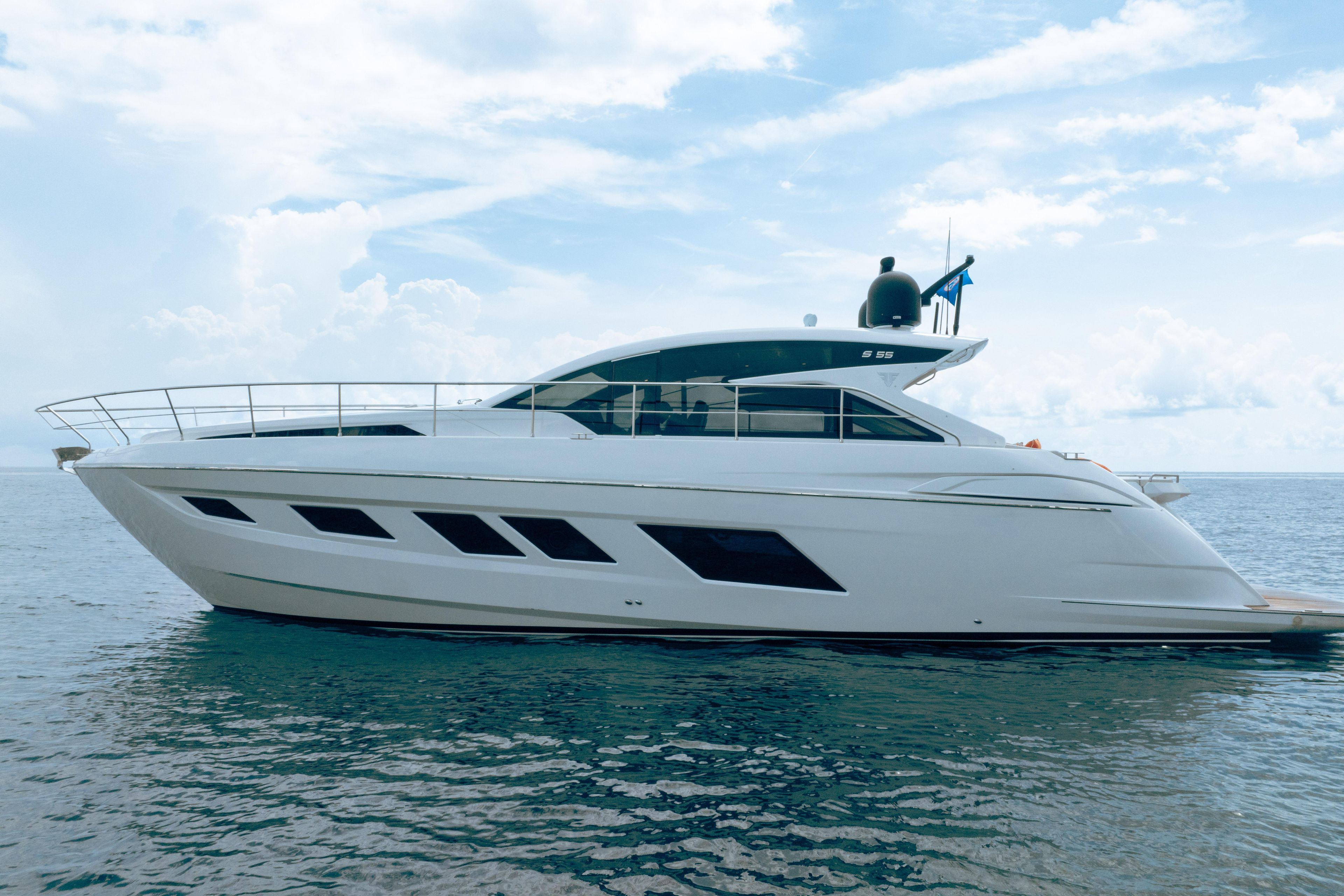 2019 Filippetti S55 yacht on calm ocean under blue sky.