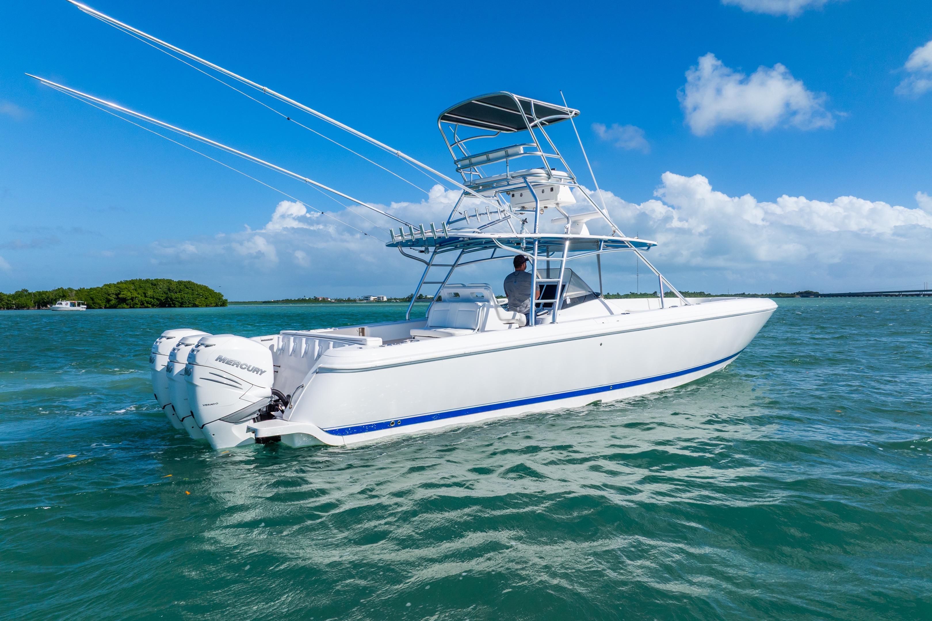 2016 Intrepid 400 Center Console boat cruising on clear blue water.
