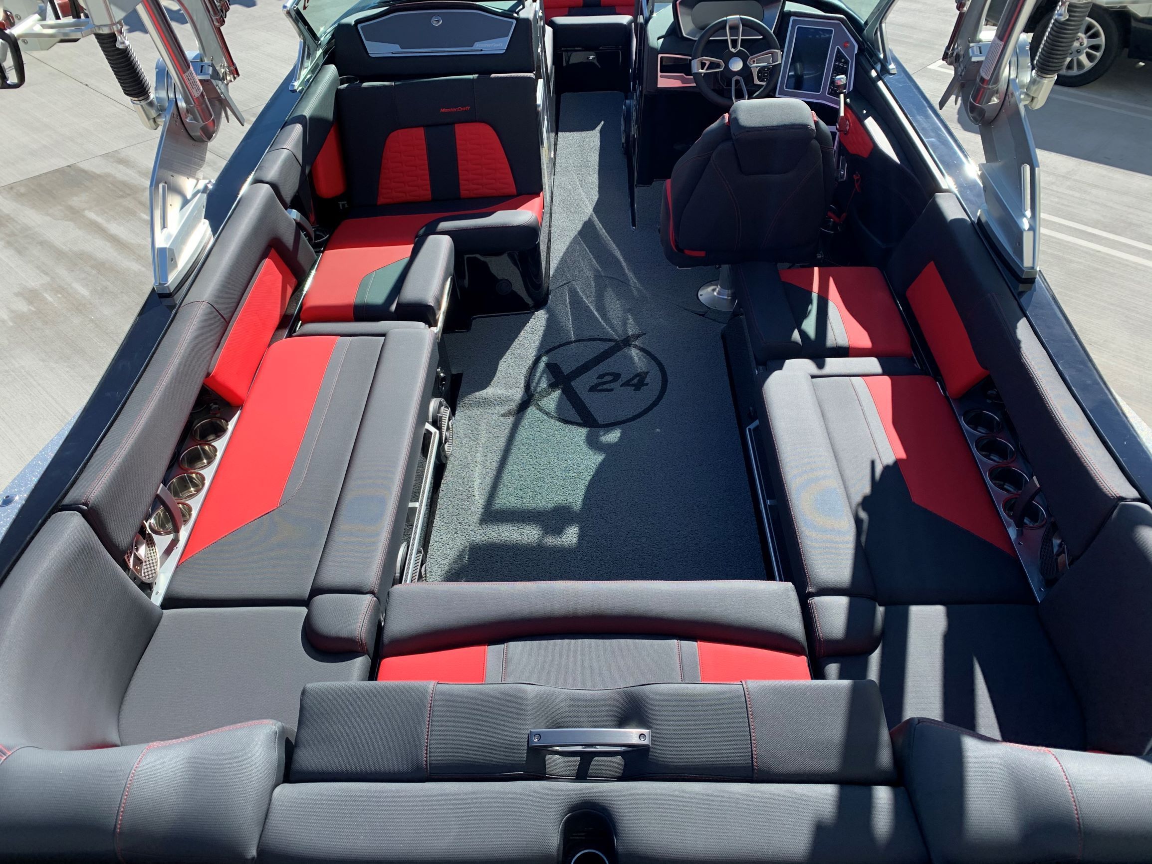 Interior of a 2020 MasterCraft X24 with red and black seating.