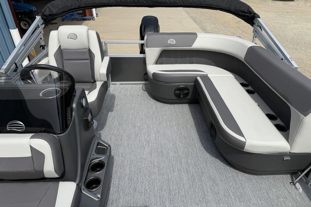 2026 Sun Tracker Bass Buggy 16 XL Select pontoon boat interior with gray seating and helm.