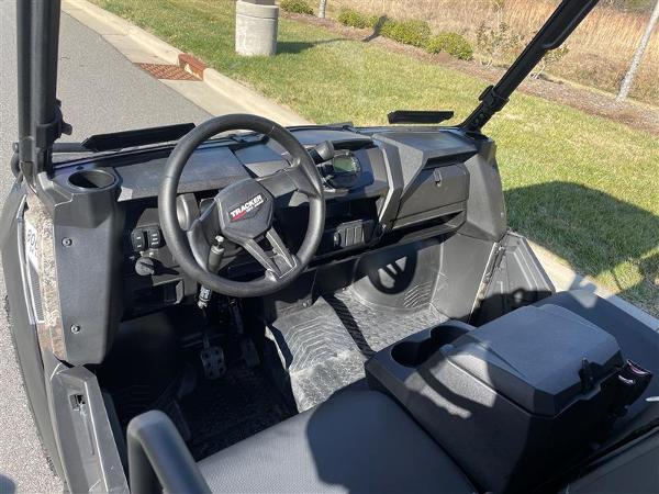 2024 Tracker Off Road 800SX LE Camo interior, showcasing steering wheel and dashboard.