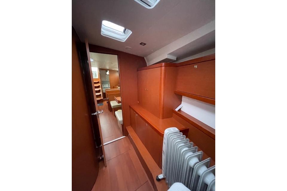 Interior of 2018 Beneteau Oceanis 45 yacht, featuring wooden cabinetry and modern design.