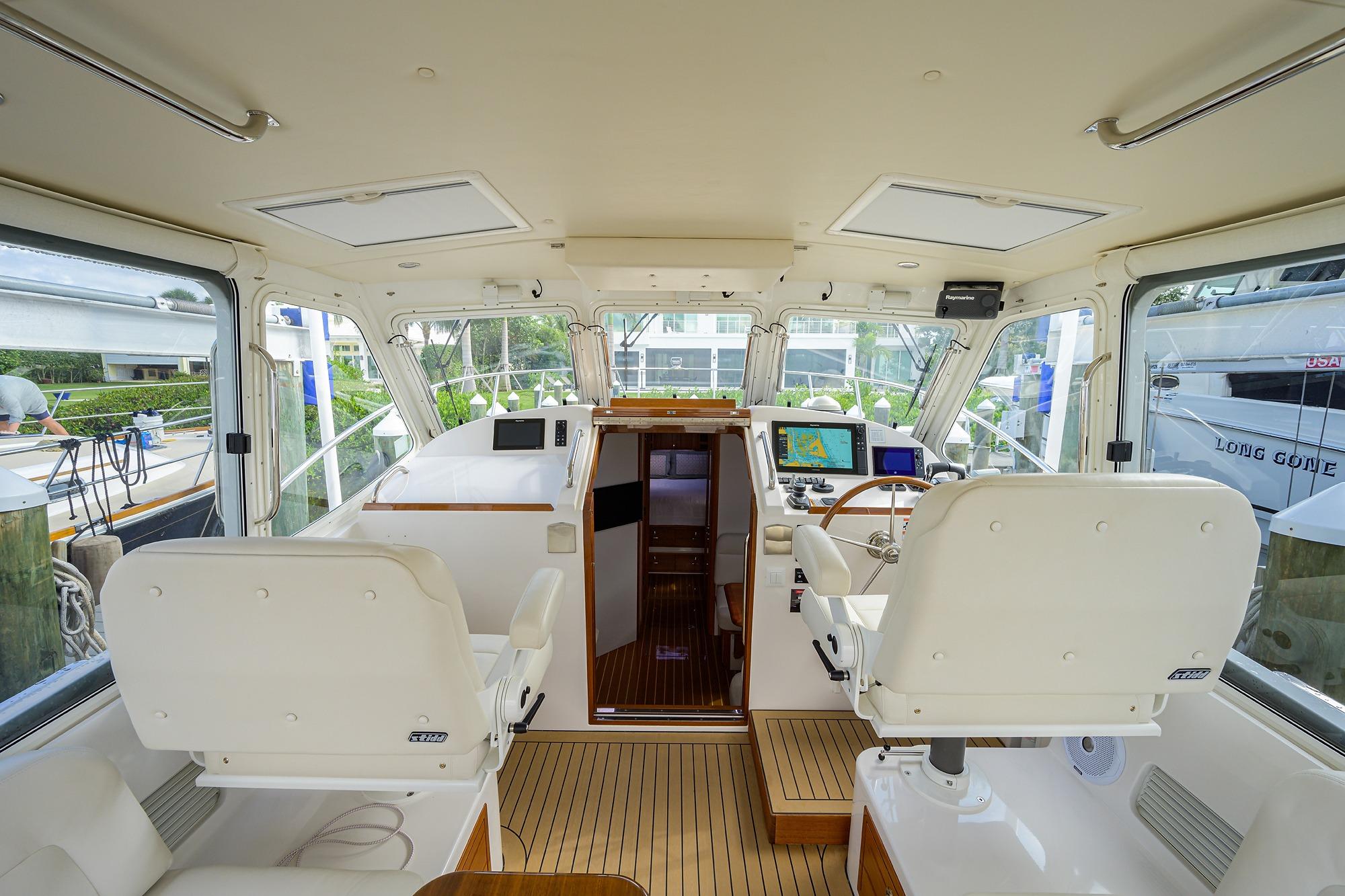 Interior of 2019 MJM 43z yacht with modern helm and seating.