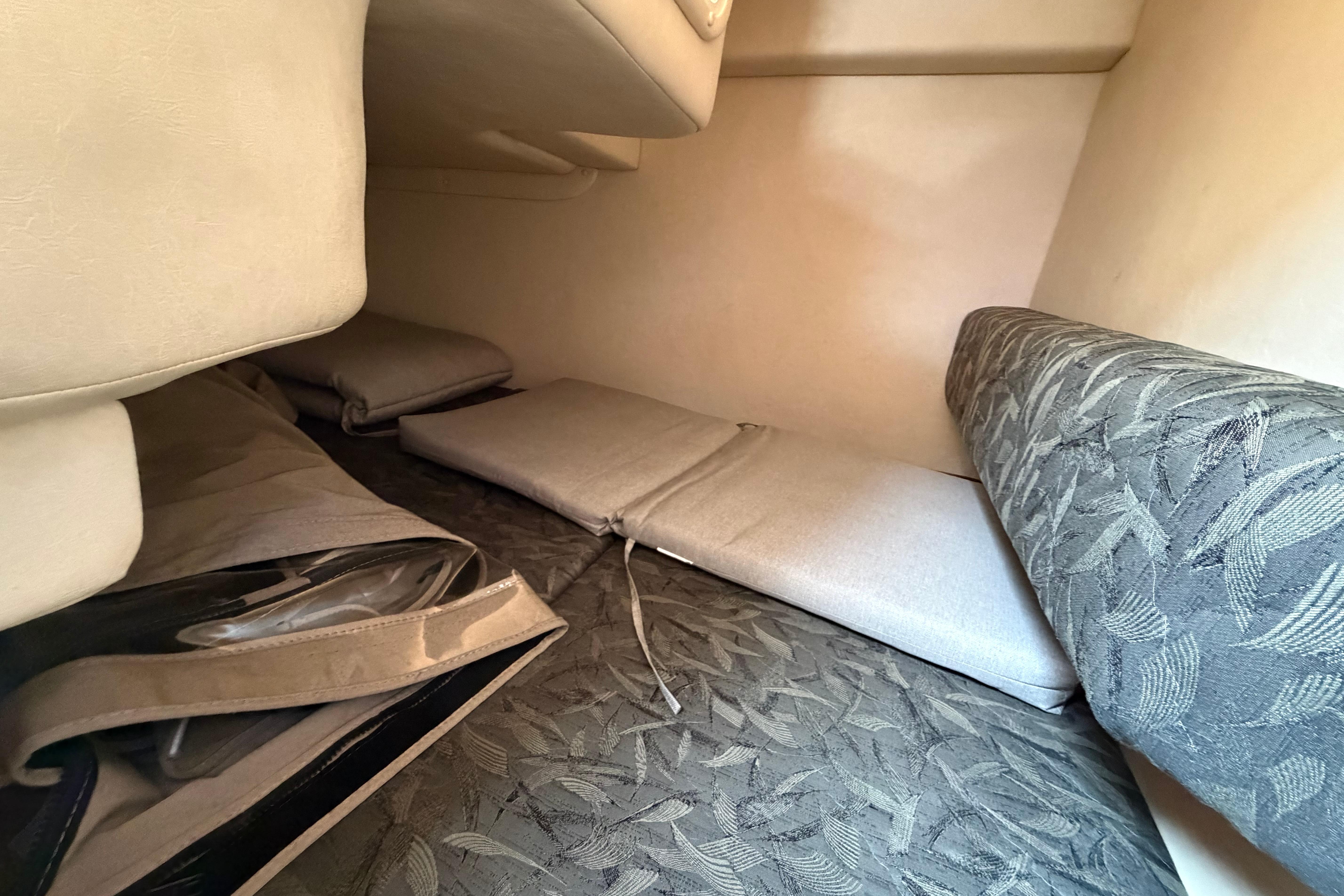 Interior cabin view of 2004 Sea Ray Sundancer 260 with cushioned seating.