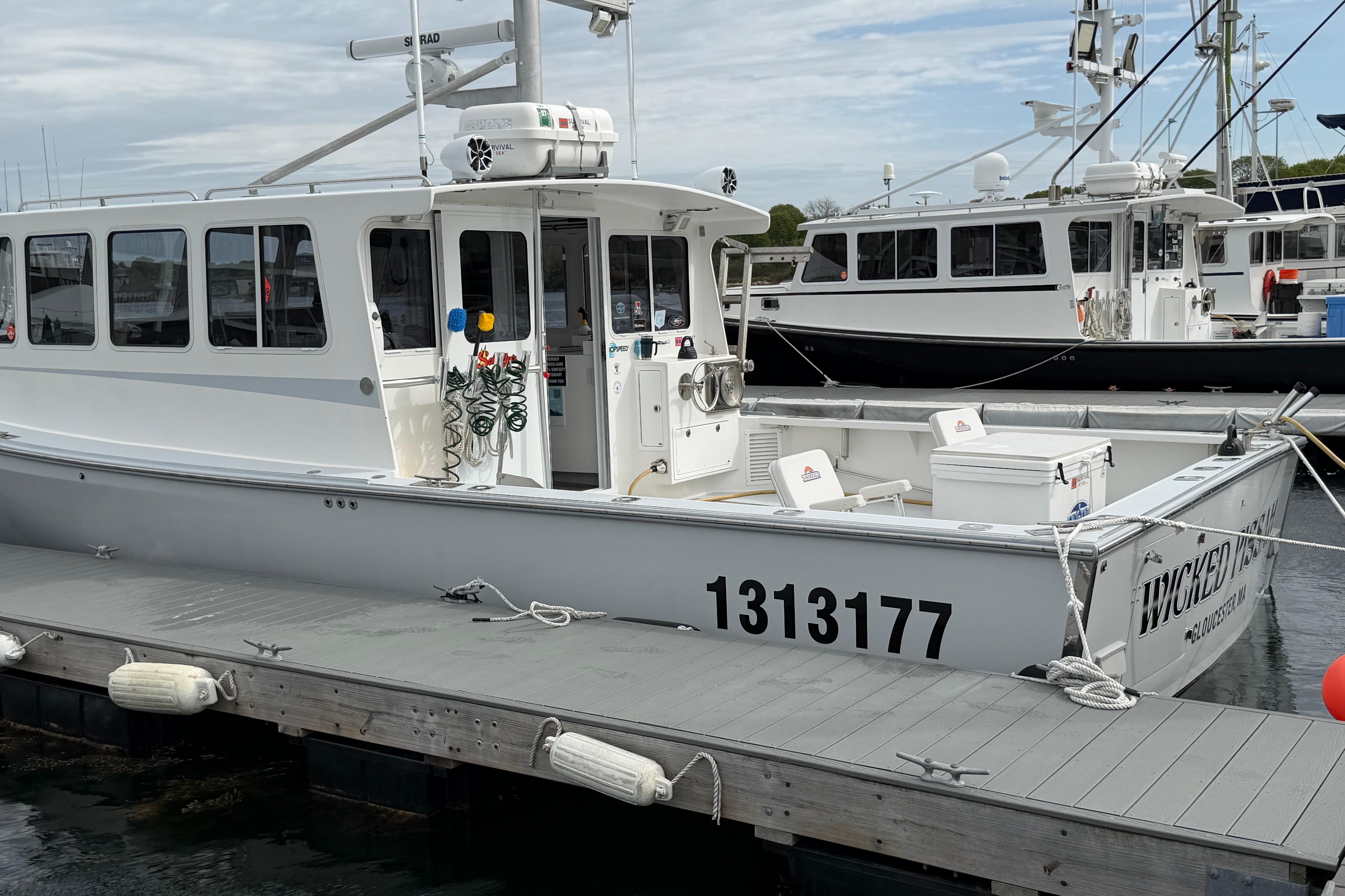 2018 H&H Marine Osmond Beal boat docked, displaying registration number 1313177.