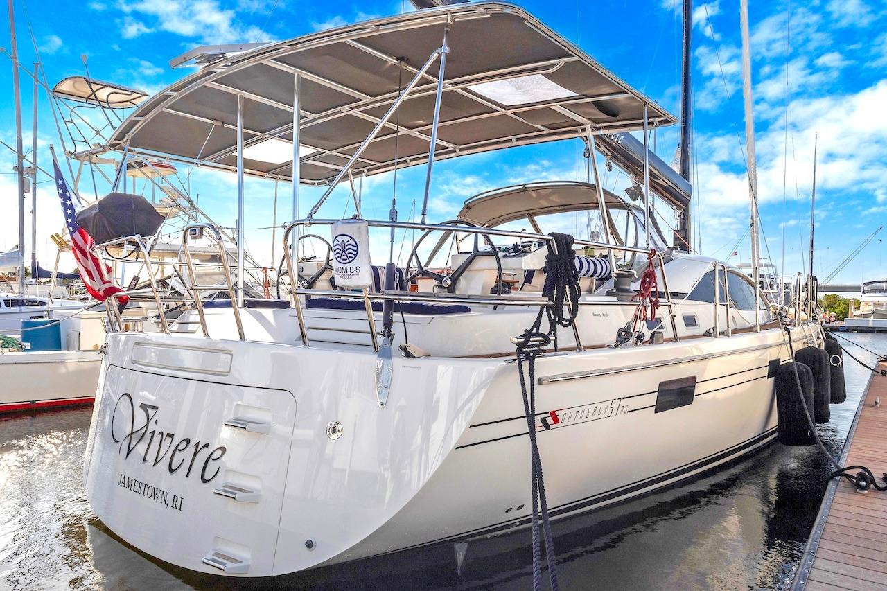 Sailing yacht Southerly 57 RS, 2011 model, docked at marina under clear blue sky.