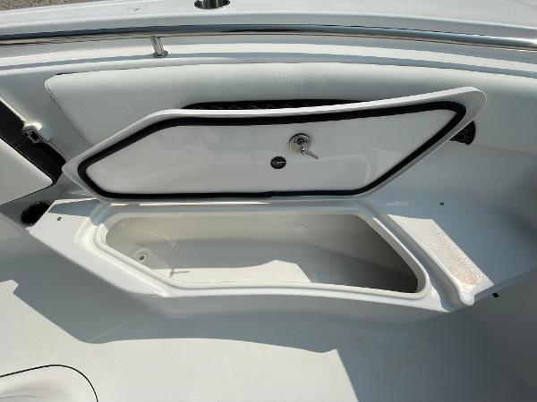 2025 Tidewater 232 CC Adventure boat storage compartment open, showcasing interior space.