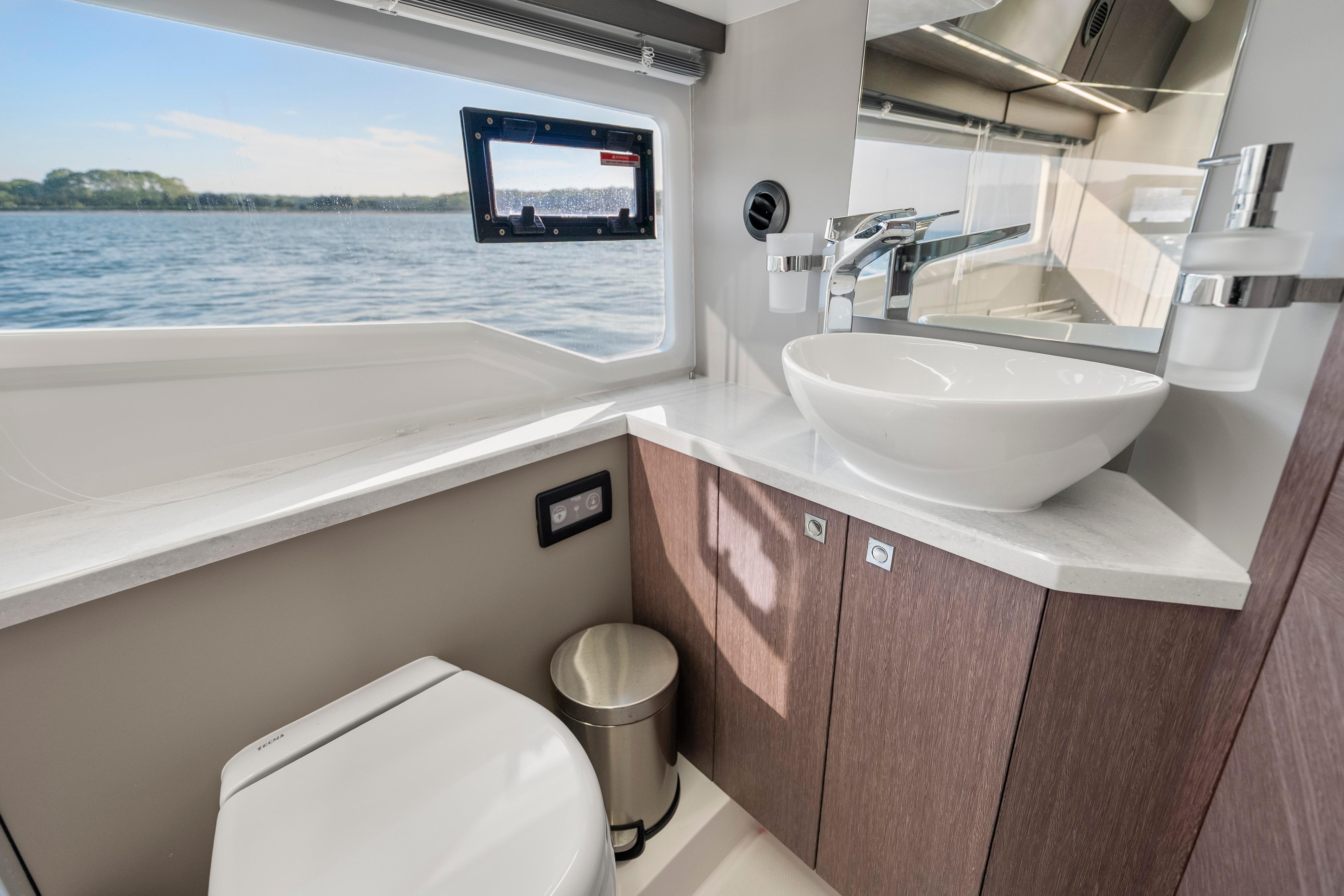 Modern bathroom on 2023 Galeon 400 Fly yacht with ocean view.