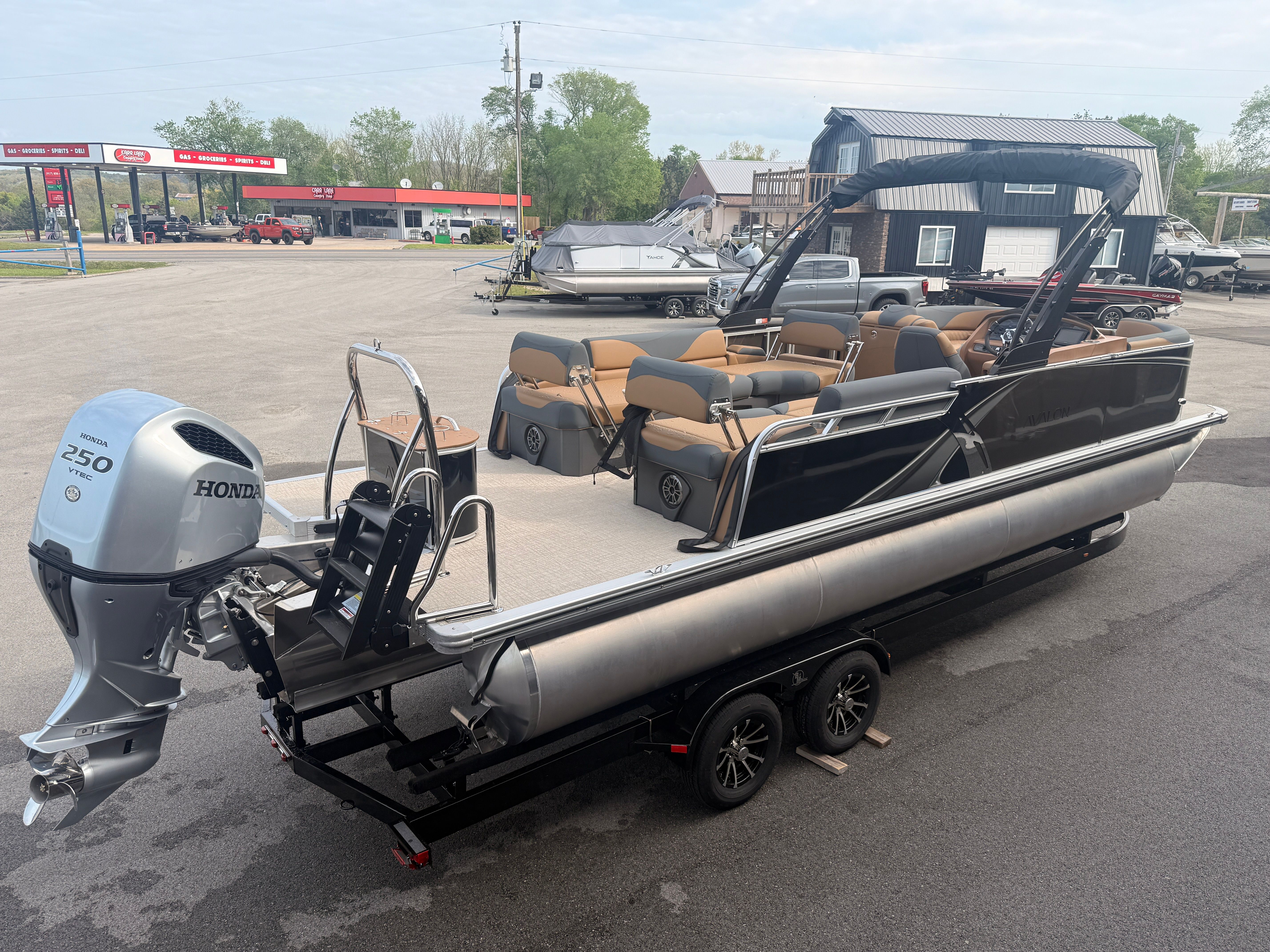 2026 Avalon 2385 LSZ pontoon boat with Honda 250 HP engine.