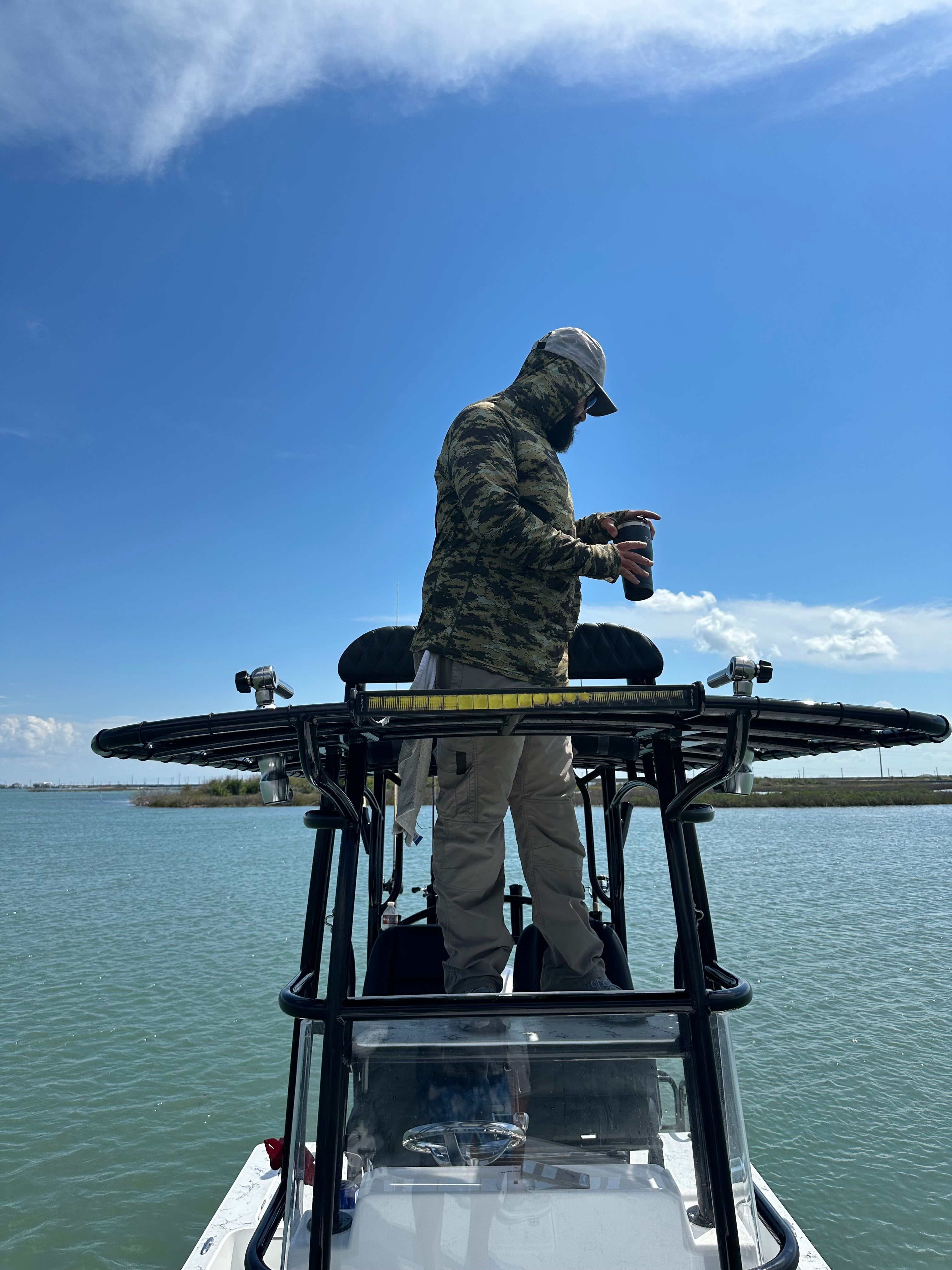 Person on Shallow Sport 25 X3 boat, 2023 model, on the water.