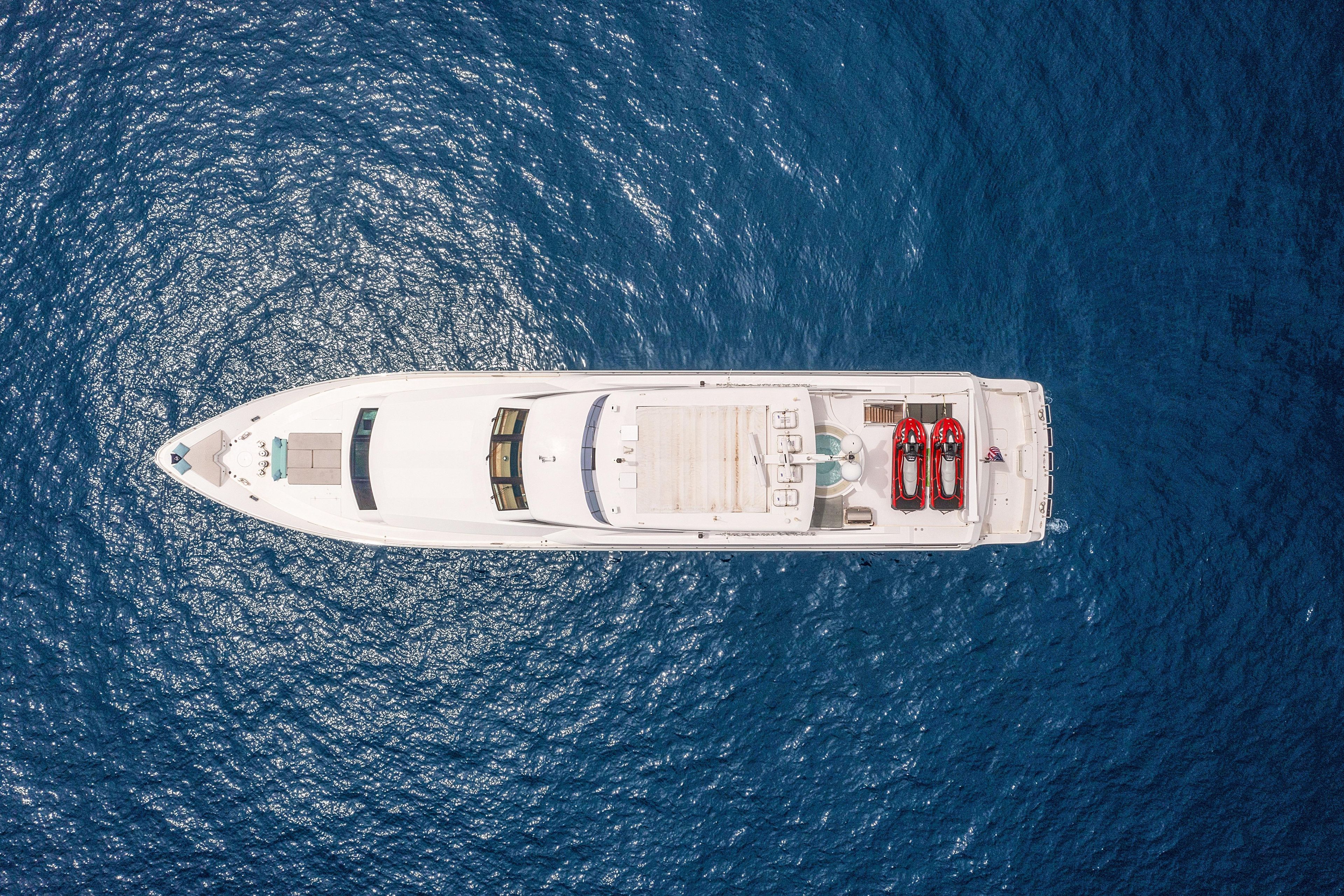 Aerial view of 2009 Hargrave Raised Pilothouse yacht on blue ocean water.