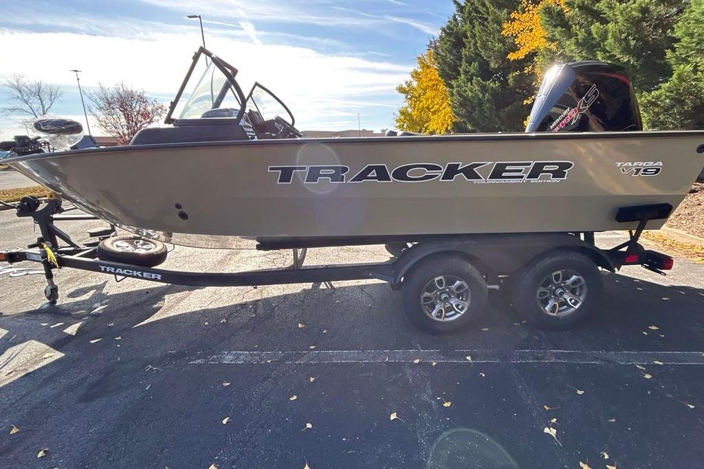 2026 Tracker Targa V-19 Combo boat on trailer, parked outdoors with autumn trees.