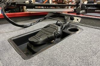 2026 Tracker Pro Team 175 boat foot pedal on carpeted deck.