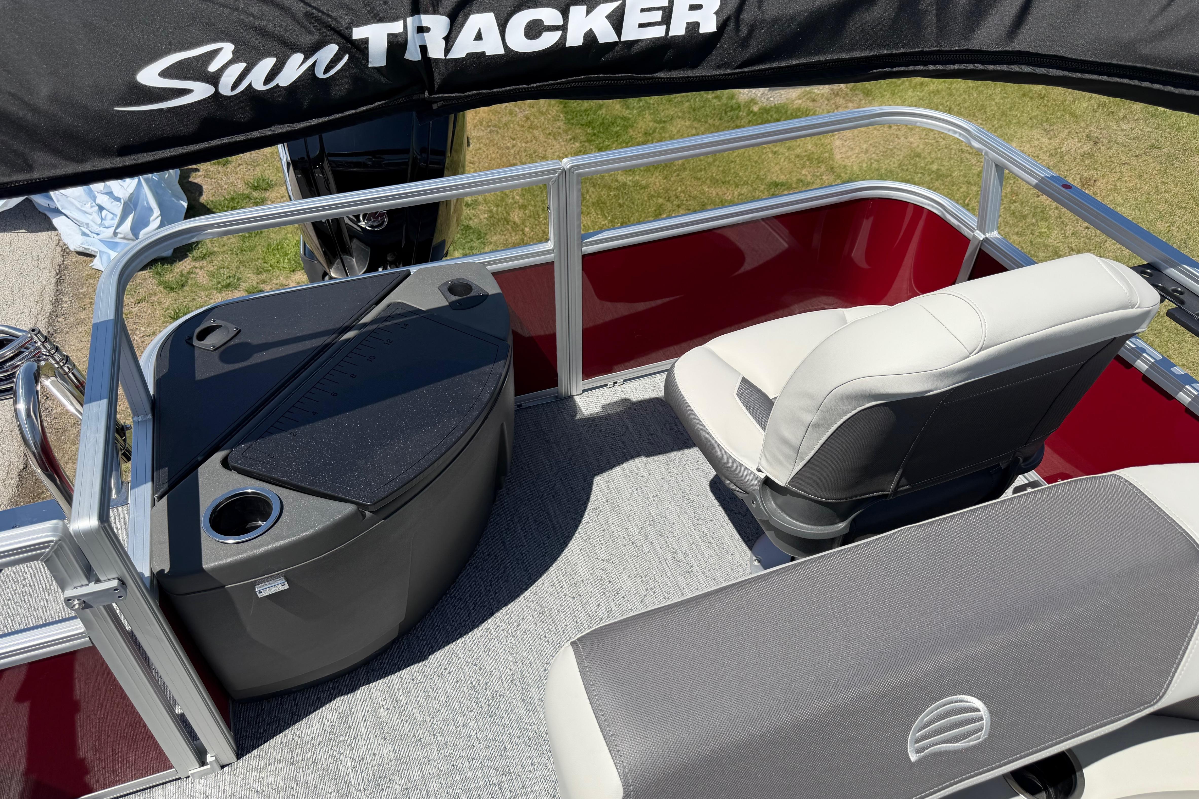 2026 Sun Tracker Bass Buggy 18 DLX pontoon boat interior with seating and storage.