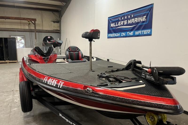2022 Ranger Z520R boat in showroom, featuring red accents and fishing equipment.