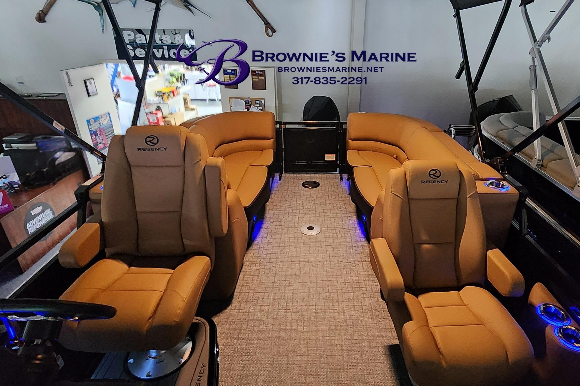 Luxurious interior of 2026 Regency 250 DL boat with plush seating and ambient lighting.
