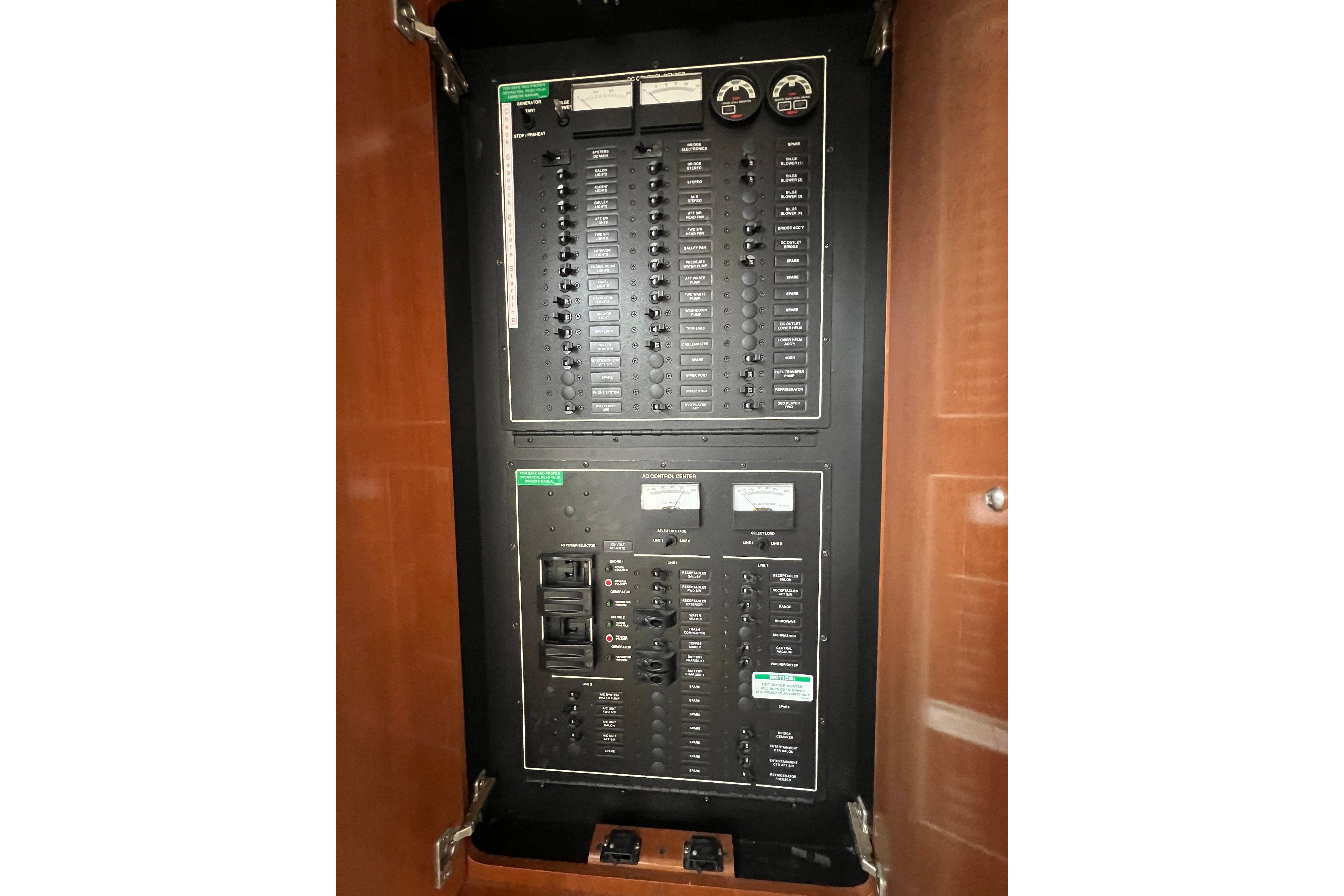 Electrical panel inside 2006 Carver 43 Motor Yacht, featuring switches and gauges.