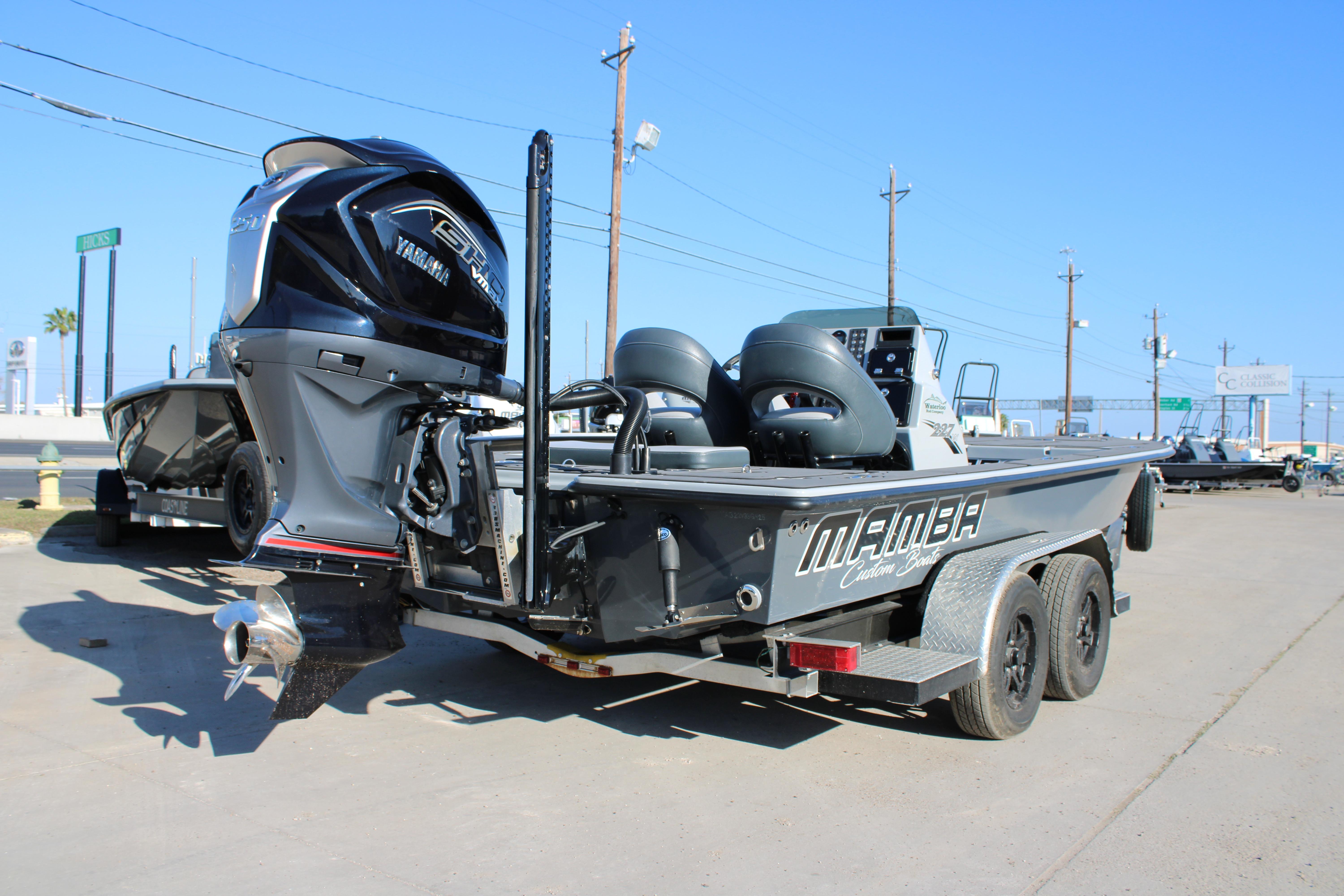 2025 Mamba 227VX boat with Yamaha engine on a trailer, parked outdoors.