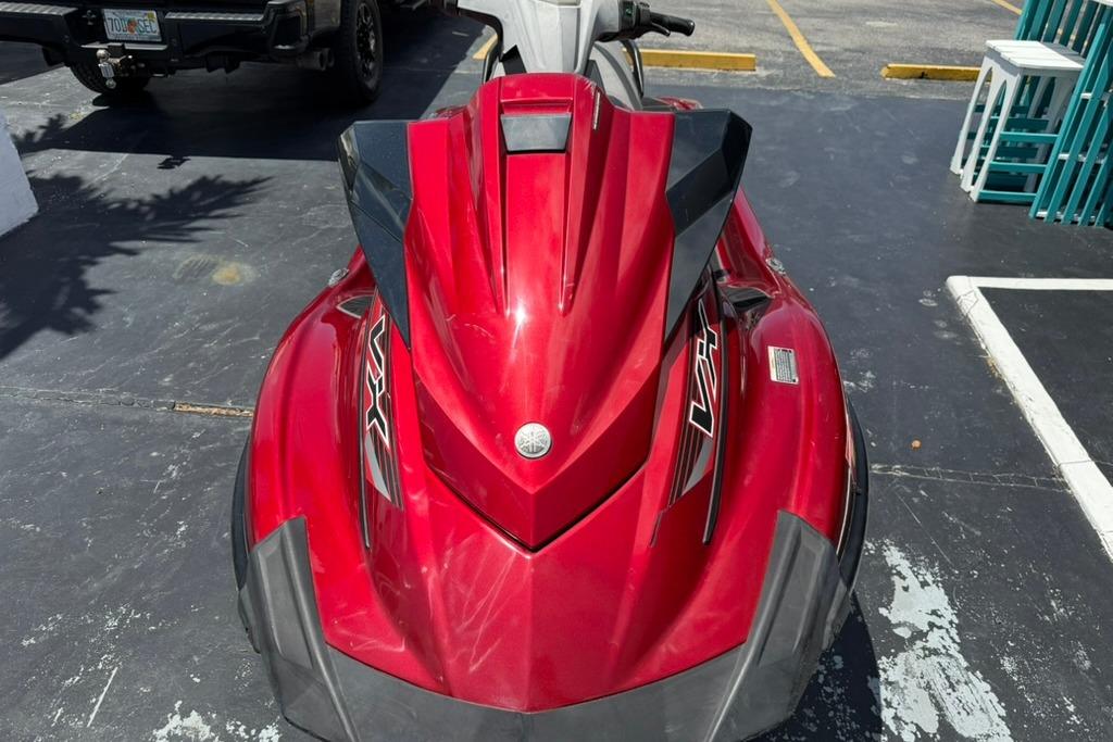 Red 2019 Yamaha VX Limited jet ski parked on asphalt surface.