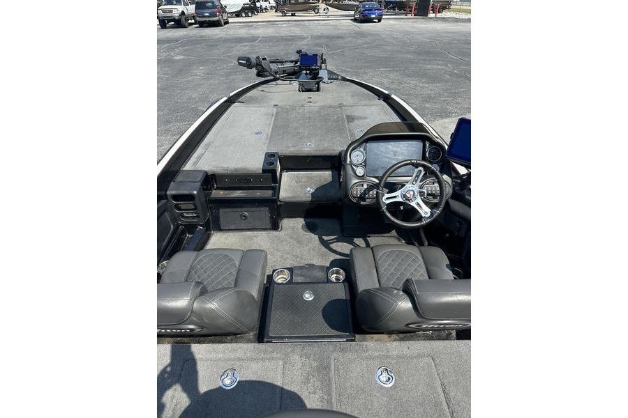 2016 Triton 20 TrX boat interior with steering wheel and seating.