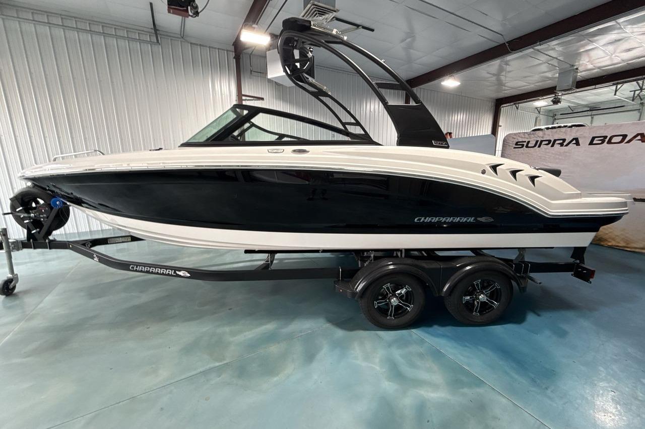 Chaparral 23 SSi 2026 on a trailer in an indoor setting.