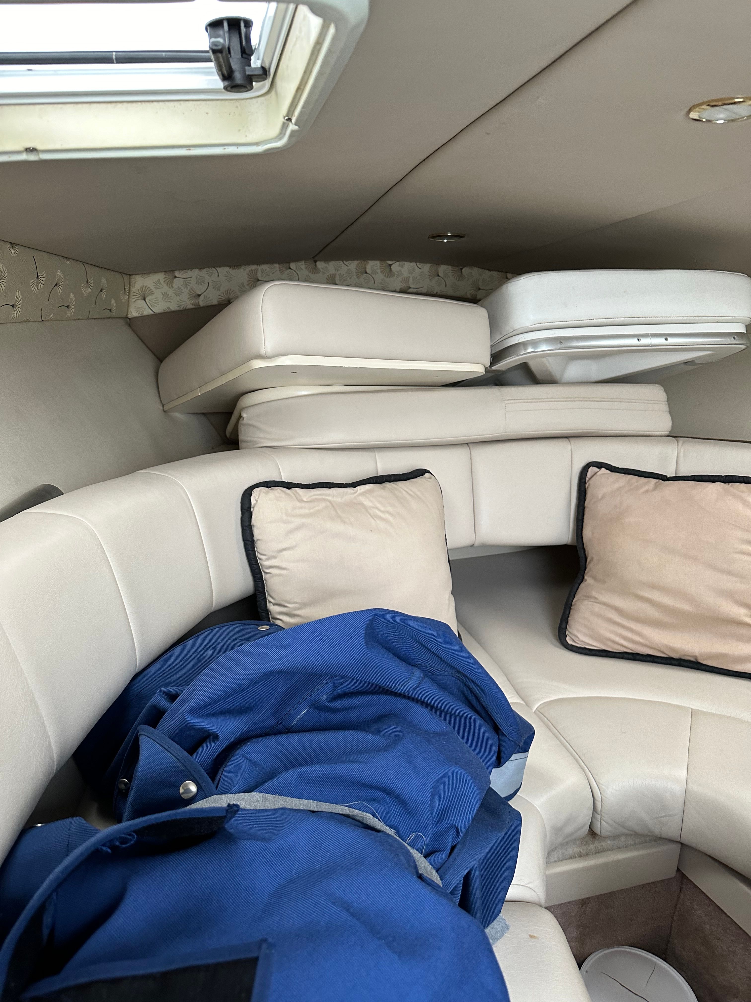 Interior of a 2000 Formula 260 Sun Sport boat with cushions.