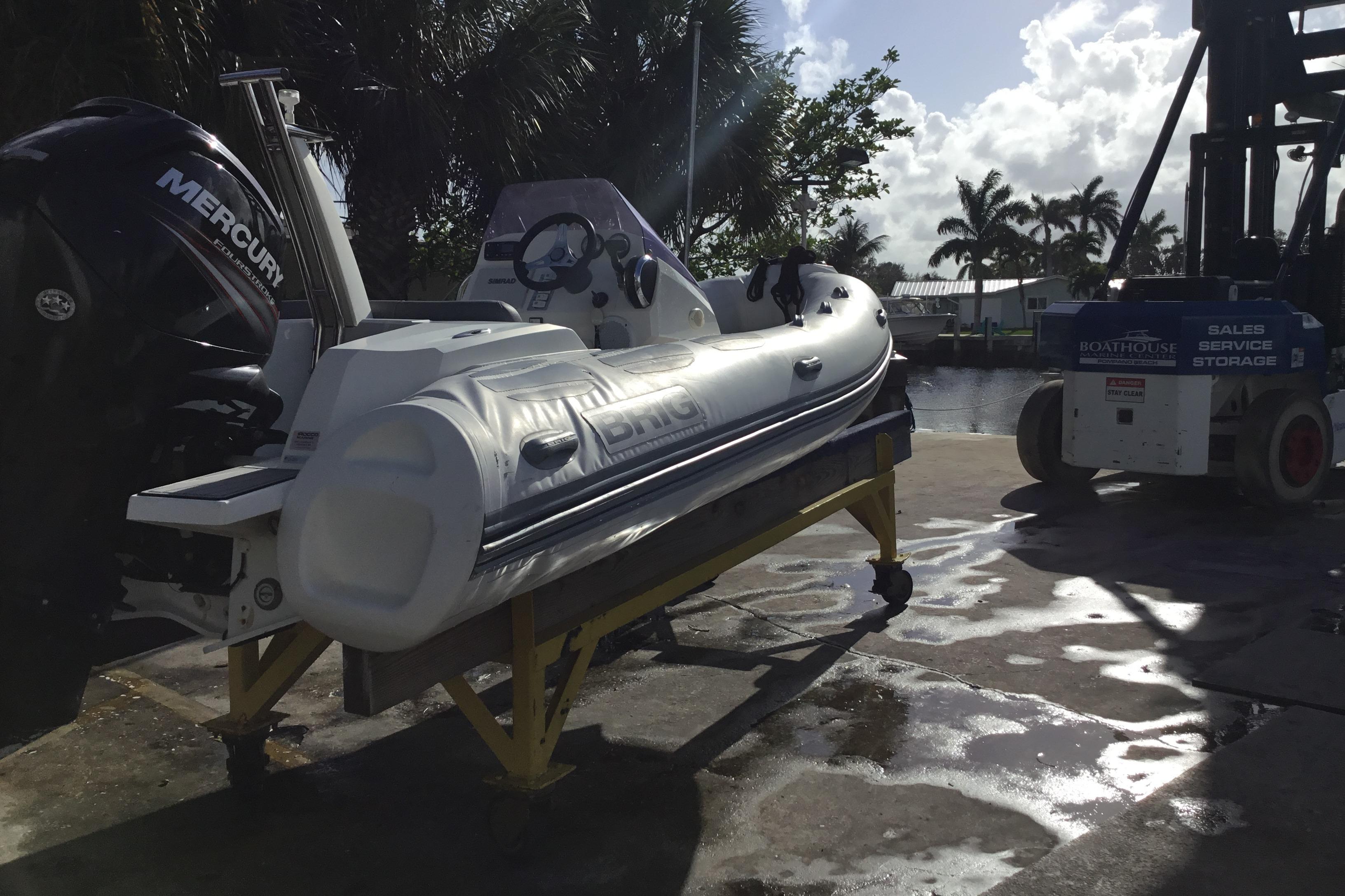 2018 Brig E 480 inflatable boat with Mercury engine on dockside stand.